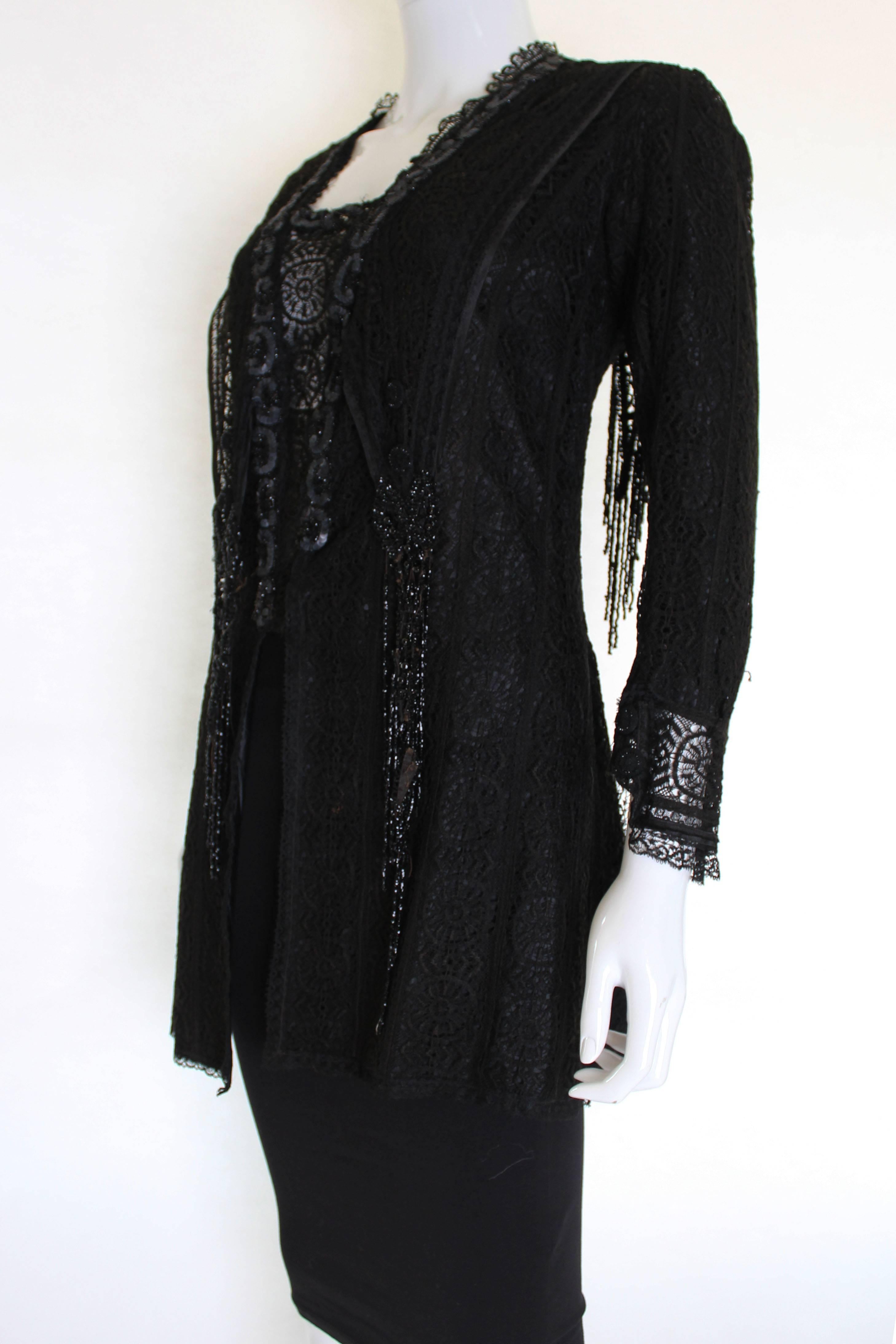 This is a wonderful black lace Victorian jacket still in a delicate but wearable condition. The main material is lace, and the jacket is fully lined in silk with weights in the hem to give great structure and shape to the piece. There is a sailor