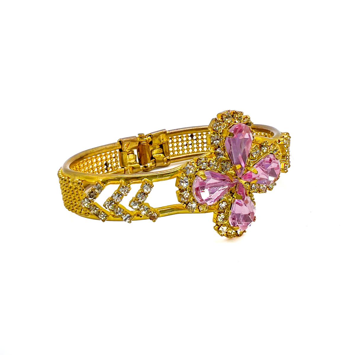 A dreamy Vintage Victorian Pink Crystal Cuff. Inspired by the bangles worn by Victorian women in the late 1800s this bracelet is no pale imitation. The golden metalwork flaunts the detail of an original and the delicate pale pink teardrop stones a