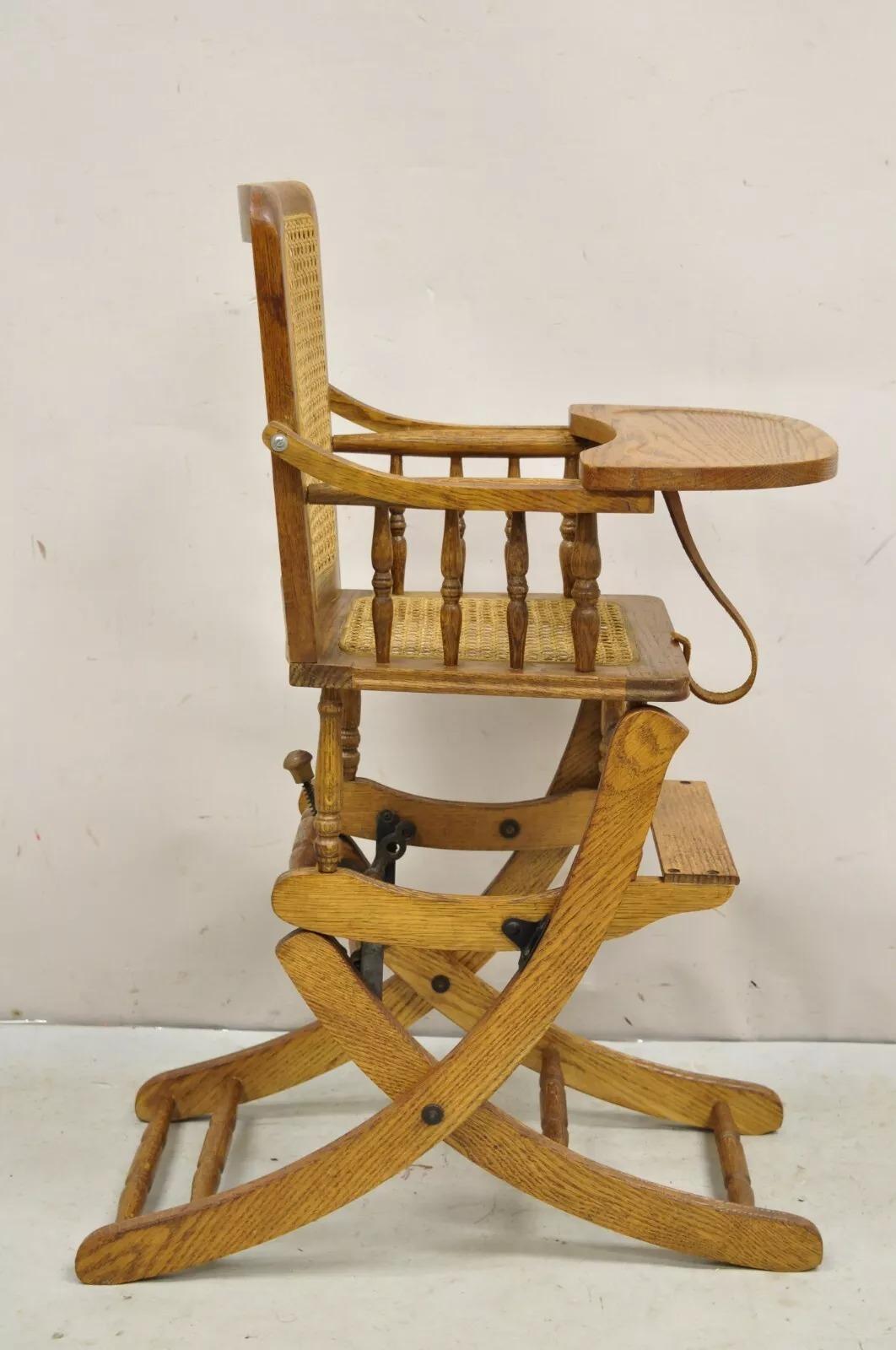 Vintage Victorian Oak & Cane Convertible Childs High Chair / Rocking Chair. Circa Early 20th Century. Measurements: 36.5