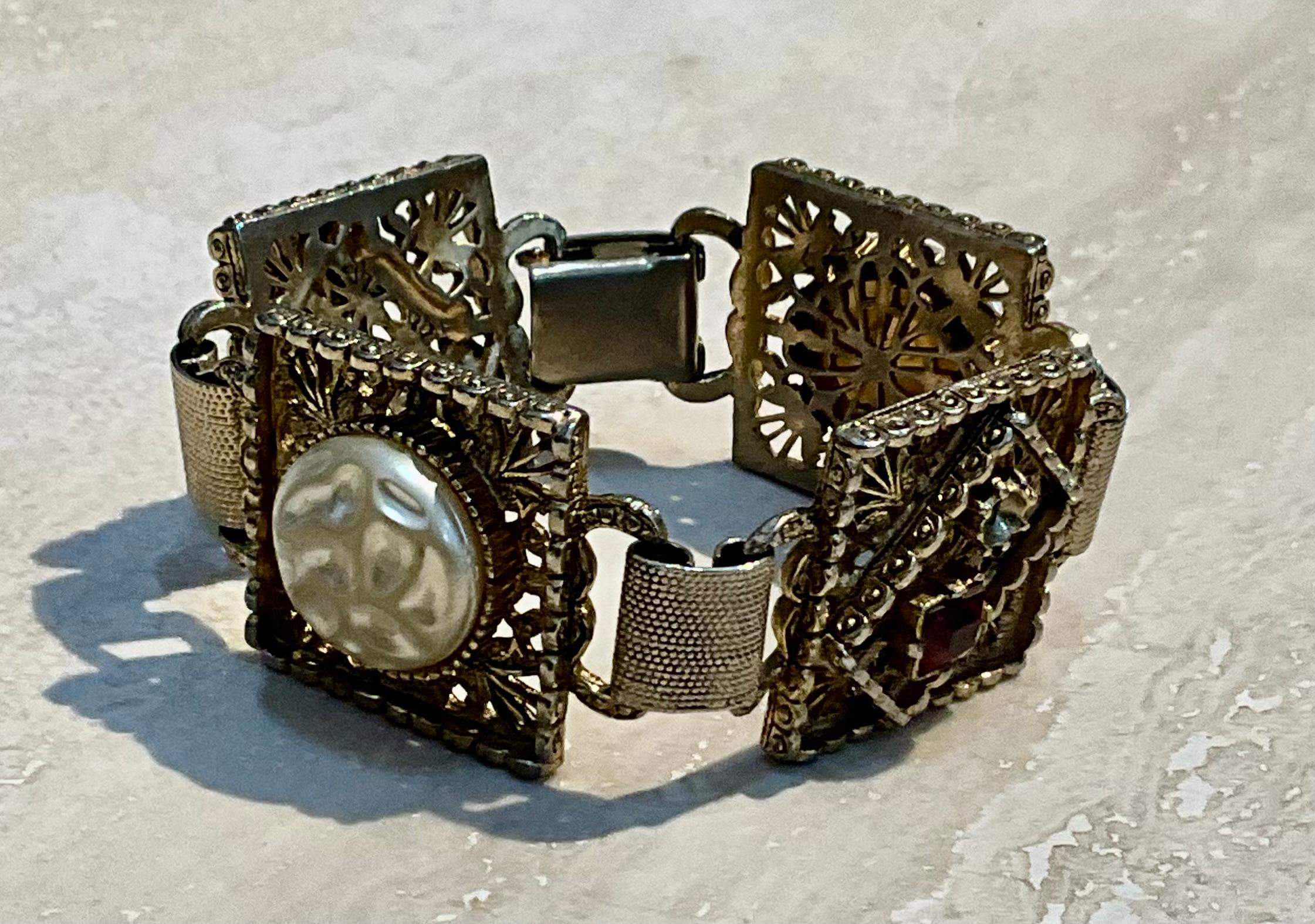 This Vintage Victorian Ornate Bracelet is a stunning example of jewelry in the style of the Victorian era, which spanned from 1837 to 1901. Known for its intricate craftsmanship, romantic design motifs, and use of luxurious materials, this type of