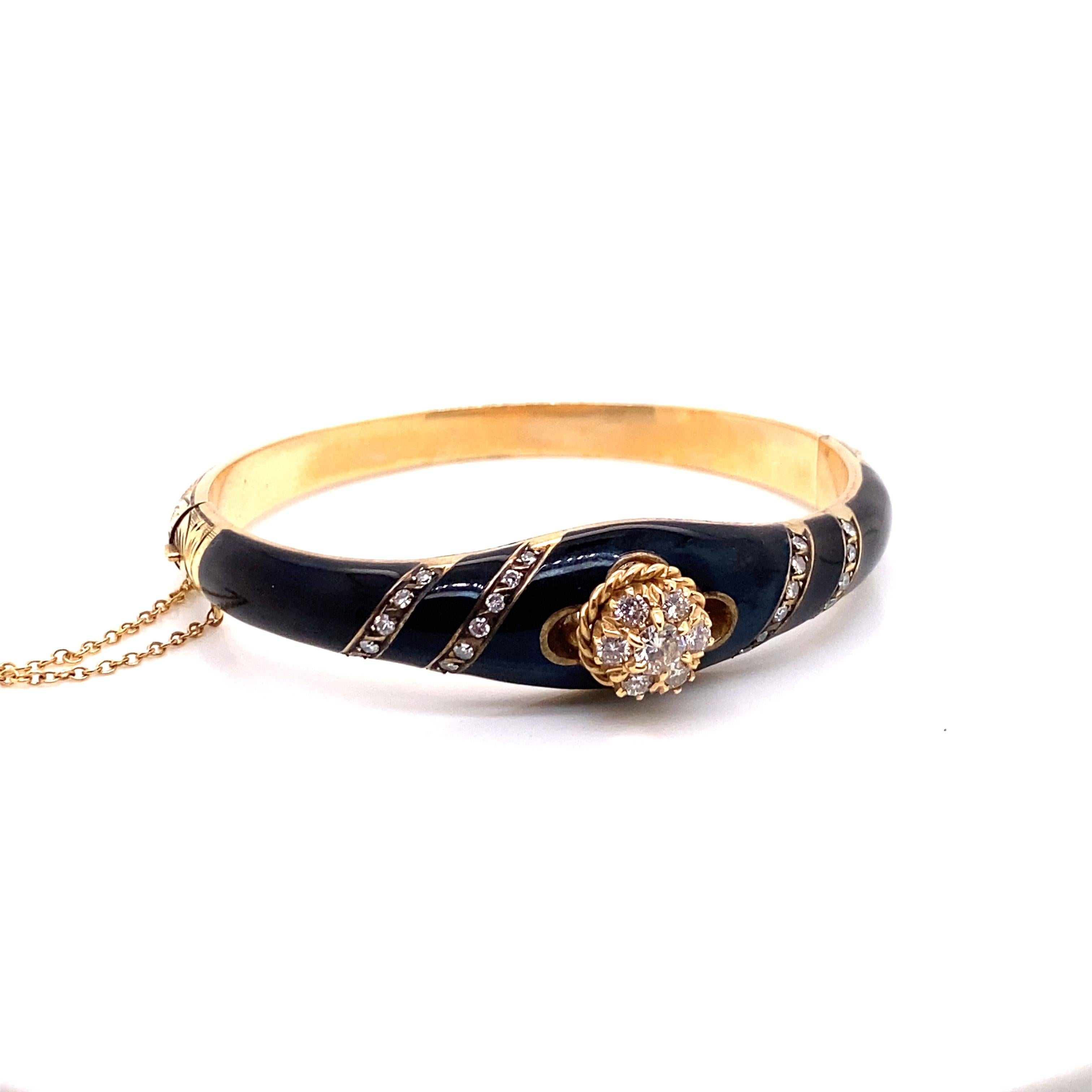 Vintage Victorian Reproduction 14K Yellow Gold Onyx and Diamond Bangle - The bracelet contains 7 round brilliant diamonds which are set in a flower cluster with a total approximate weight of .50ct. The diamond quality is G - H color VS2 clarity.