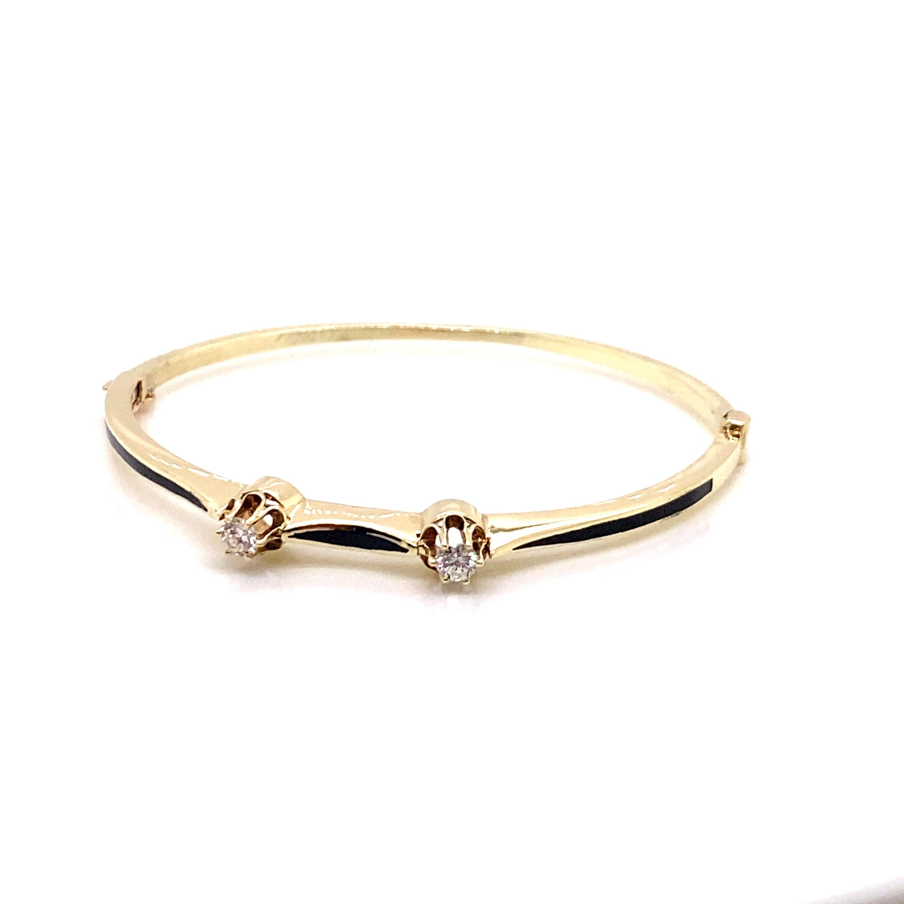 Vintage Victorian Reproduction Diamond and Black Enamel Bangle - The bangle contains 2 round brilliant diamonds set in 6 prong heads. The total weight is approximately .30ct with G color and VS2 clarity. The inside diameter is 1.75 inches high by