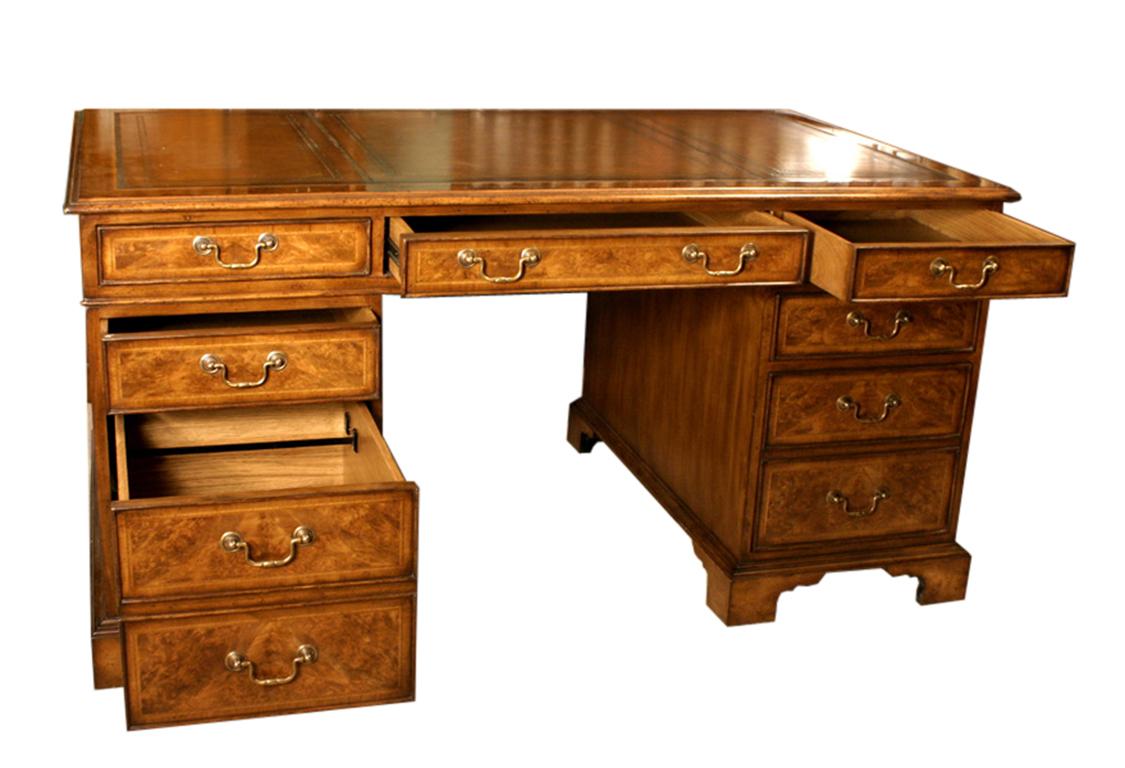 This is an exquisite vintage burr walnut pedestal desk dating from the late 20th Century.

This desk has been accomplished in the Victorian manner and was beautifully made by a craftsman from burr walnut with oak lined drawers and attractive