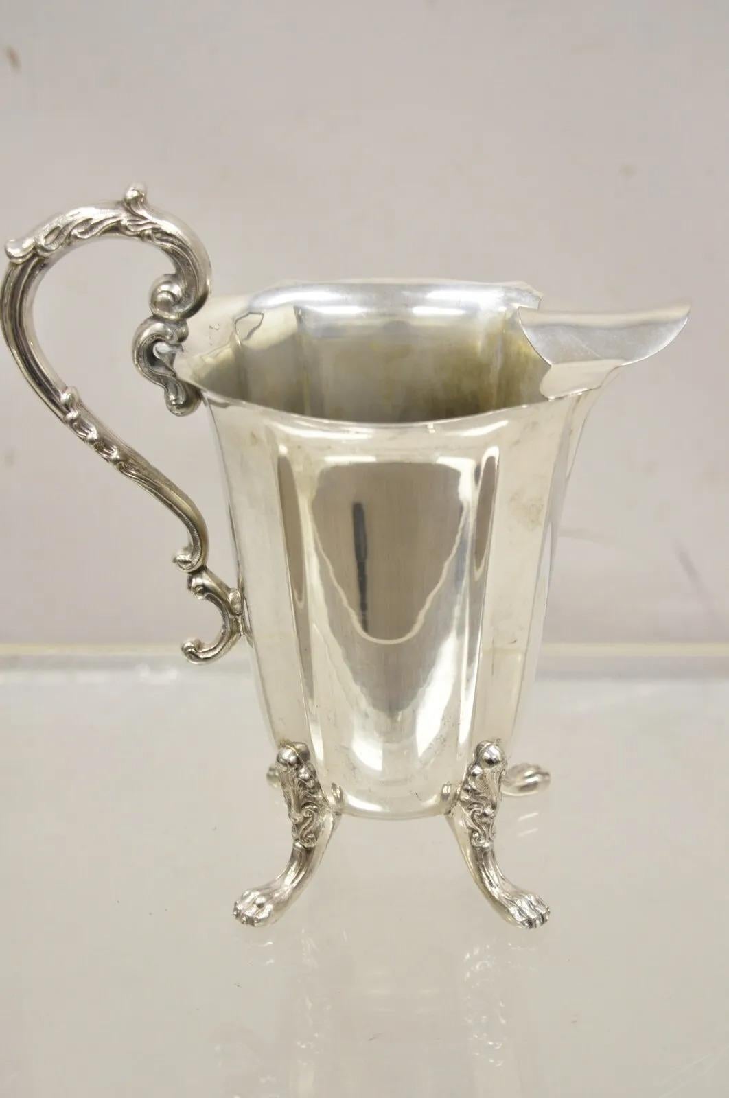 Vintage Victorian Silver Plated Fluted Paw Feet Footed Water Beverage Pitcher. Circa Early to Mid 20th Century. Measurements:  10.5