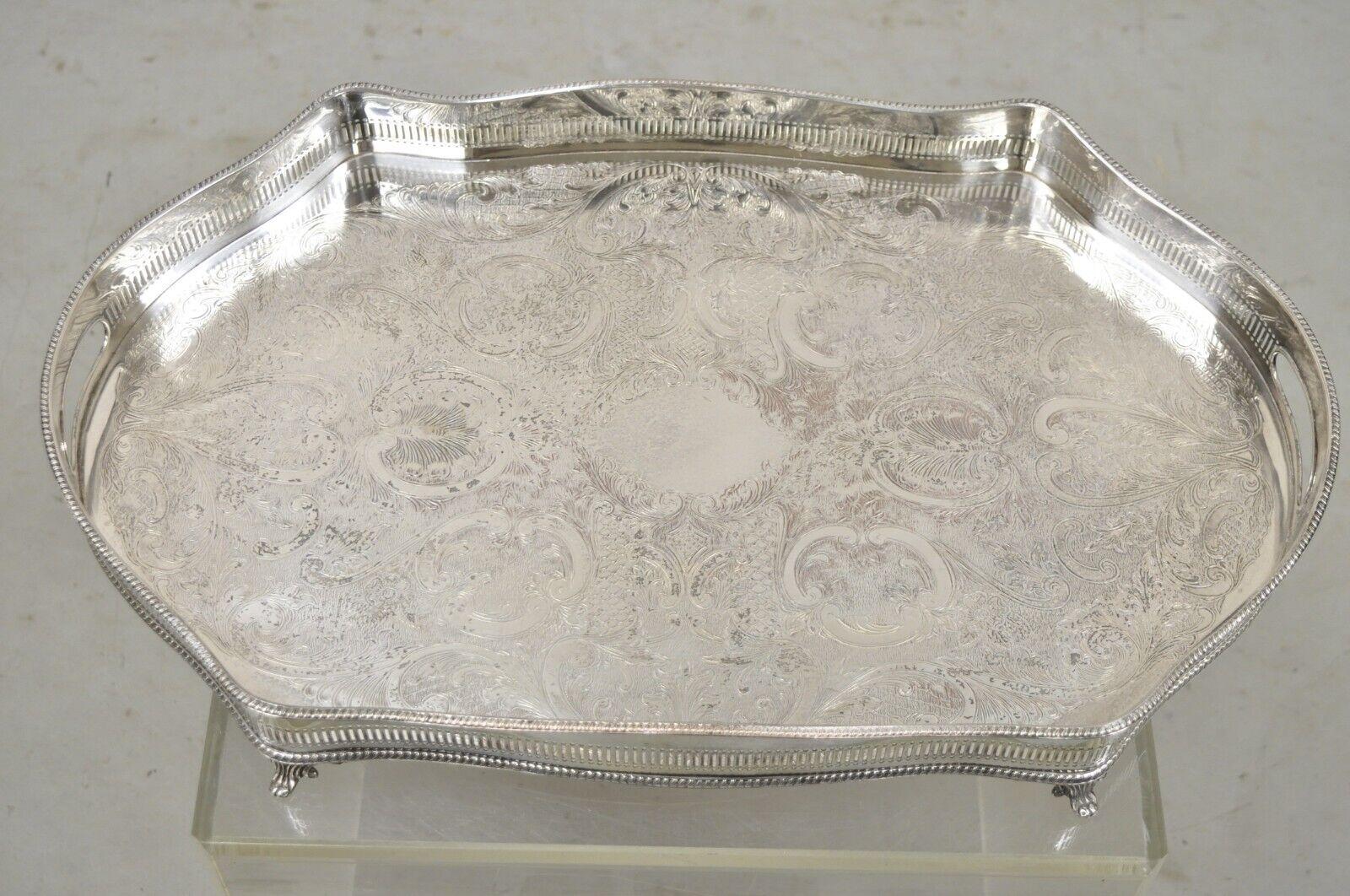 Vintage Victorian silver plated pierced Gallery Scalloped serving platter tray. Item features a pierced raised gallery with handle cutouts, raised on fancy feet, ornate etched scrollwork to center, very nice vintage item, great style and form, circa