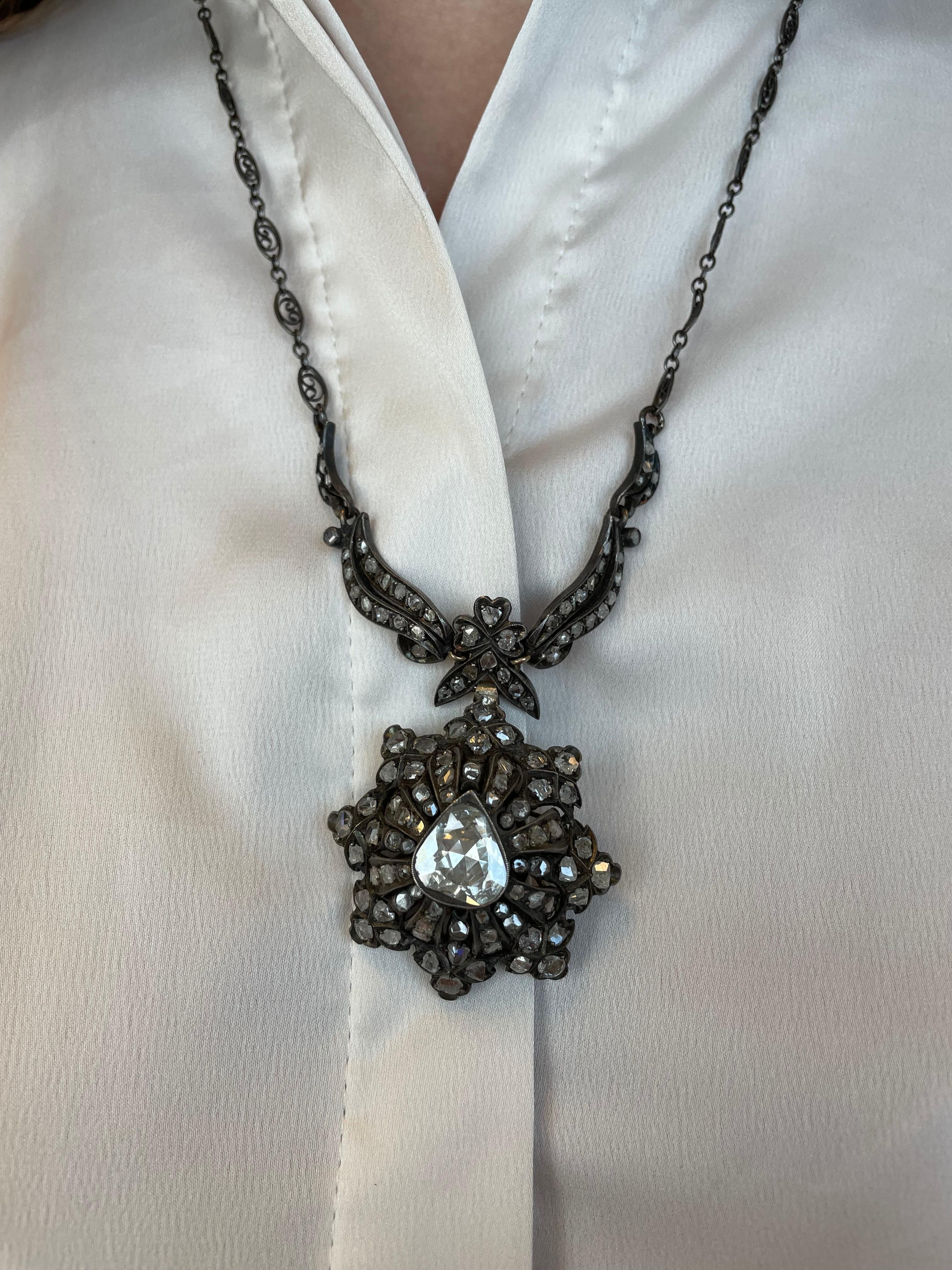 Stunning vintage rose cut diamond drop pendant necklace.
Approximately 4.30 carats of rose cut diamonds, center apx 1.30ct. Approximately I/J color and SI clarity. Silver.
Accommodated with an up-to-date appraisal by a GIA G.G. once purchased, upon