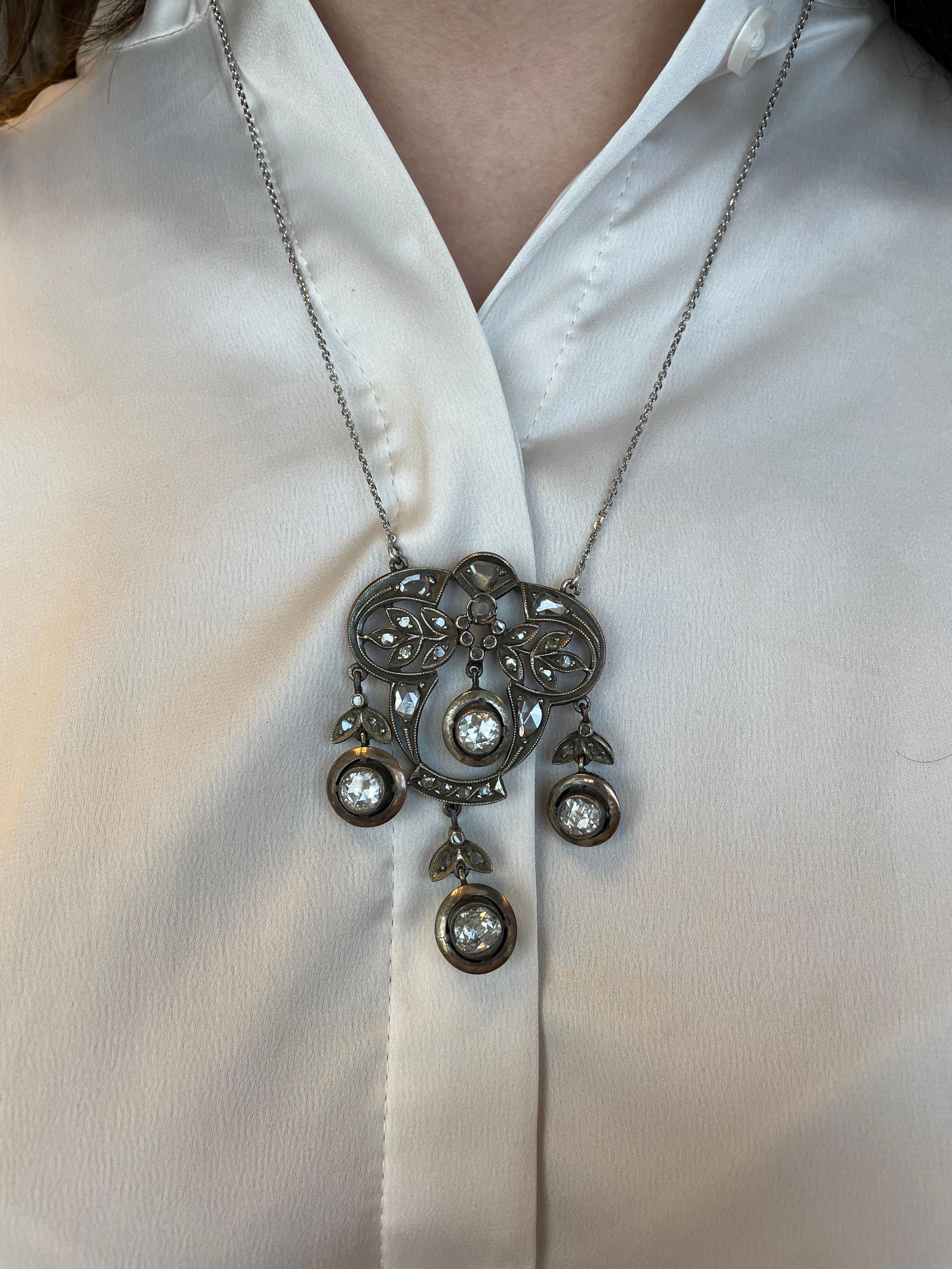 Stunning vintage rose cut diamond drop pendant necklace.
Approximately 5.30 carats of rose cut diamonds. Approximately I/J color and SI clarity. Silver & Gold.
Accommodated with an up-to-date appraisal by a GIA G.G. once purchased, upon request.