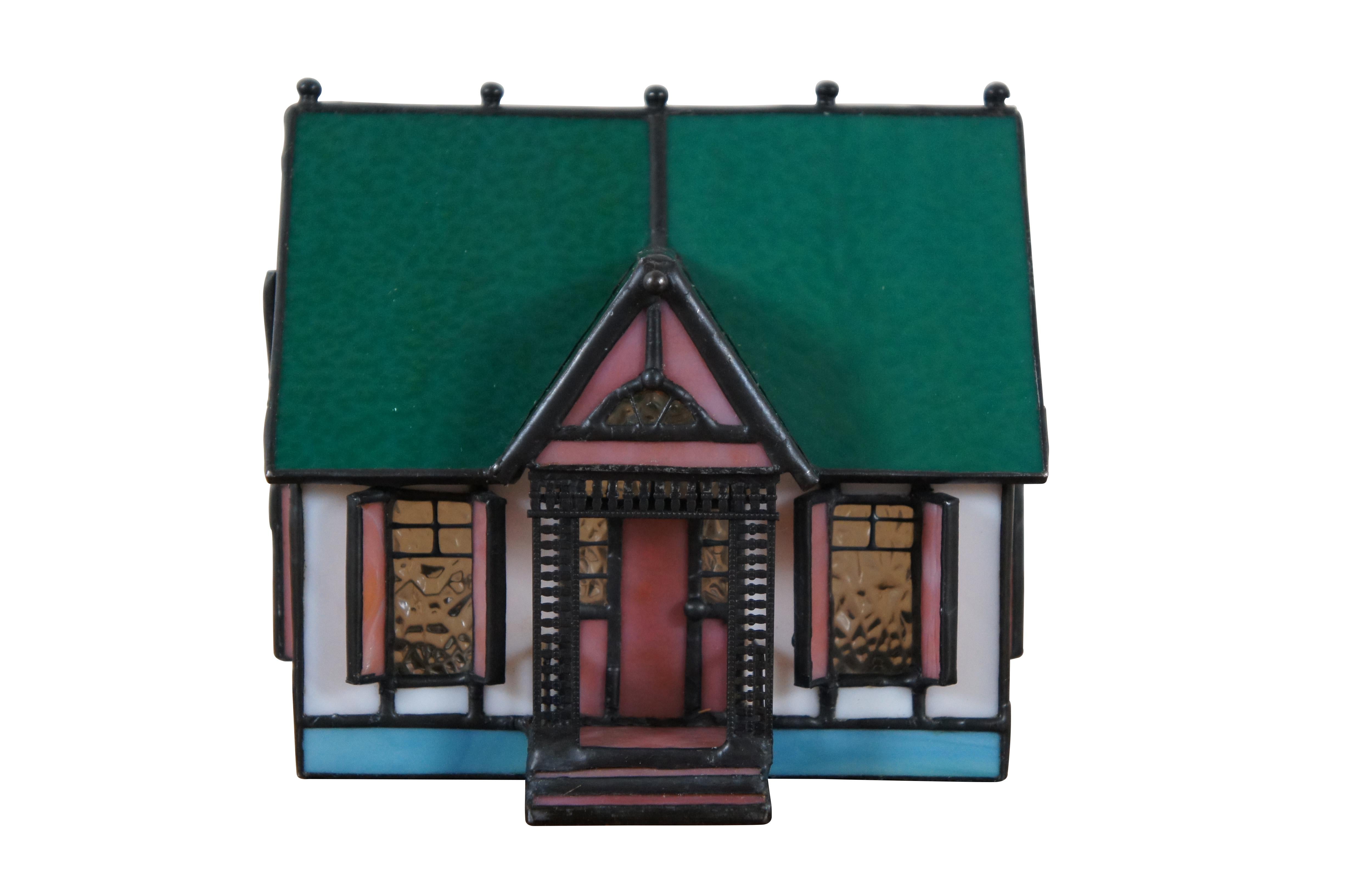 Vintage stained glass night light or lamp featuring a Victorian home or cottage with porch, shutters and green roof with finials.

Dimensions:
5.25