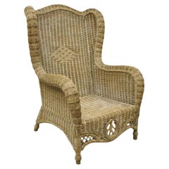 Vintage By, grande poltrona da salotto in vimini e rattan intrecciato.