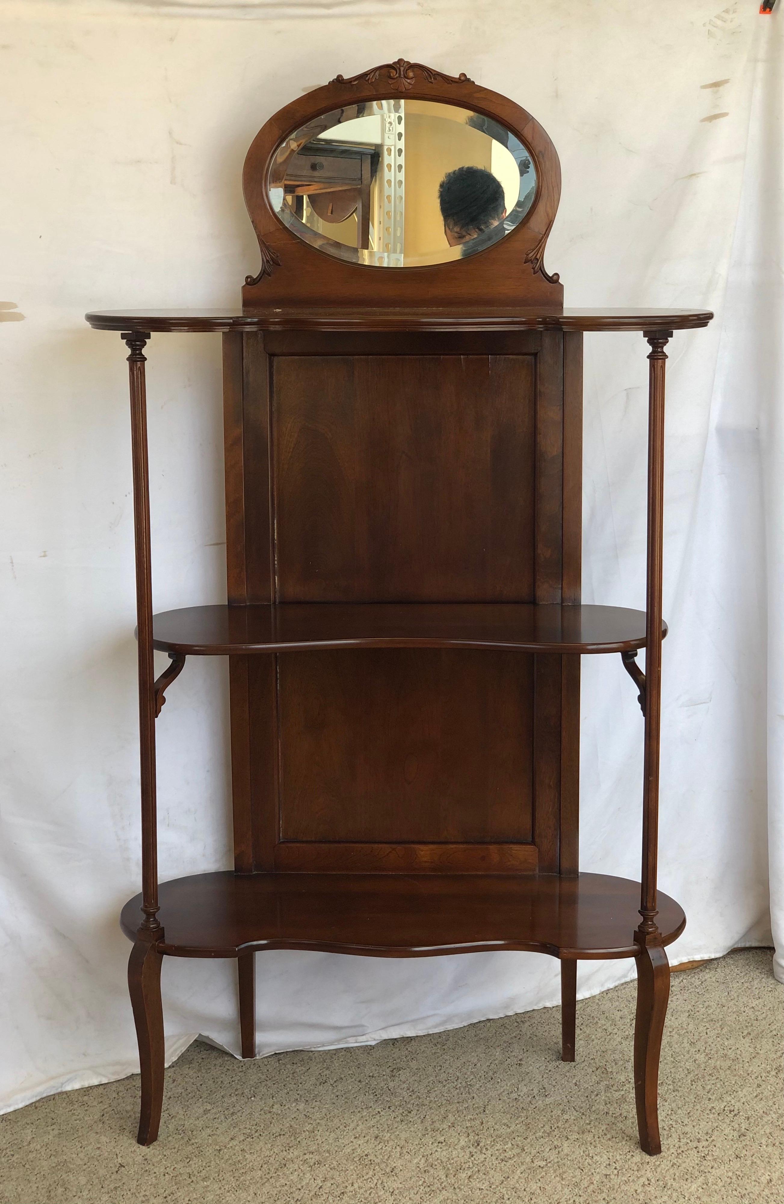 Vintage etagere or hall stand with three shelves and beveled mirror. 

Dimensions Overall: 34W 13D 61H 
46.75H (without Mirror).