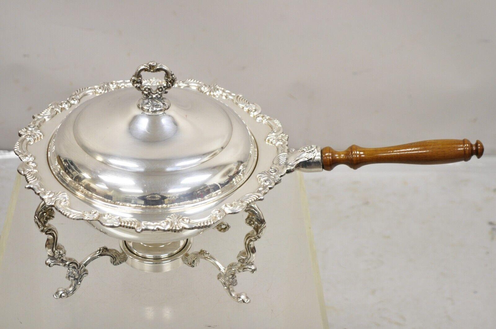 Vintage Victorian Style Ornate Silver Plated Chafing Dish Food Warmer with Wooden Handle and Burner. Circa Mid 20th Century.
Measurements:  11.5