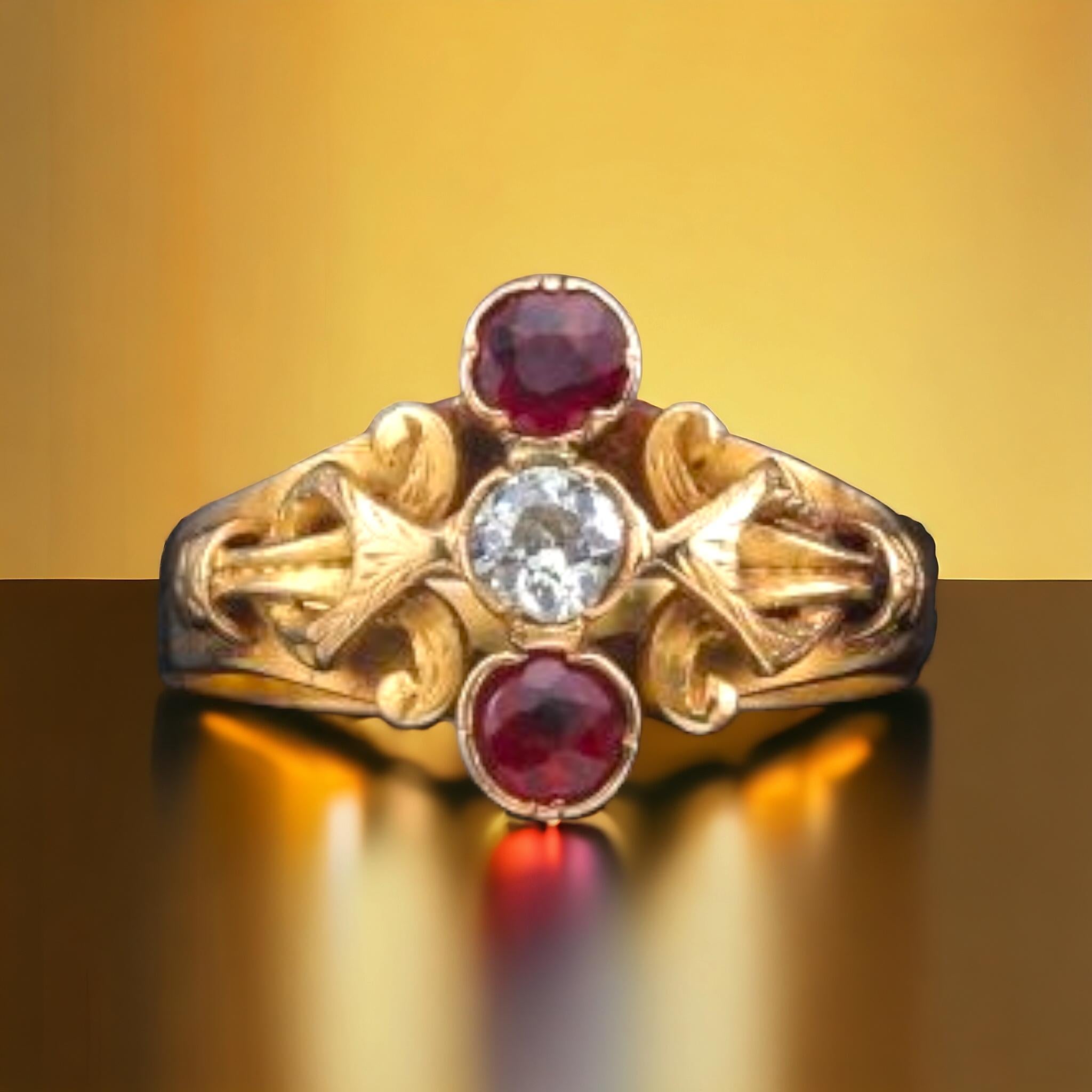 VINTAGE VICTORIAN STYLE RUBY AND DIAMOND THREE STONE RING
Fine elongated shape with 2 bright, vibrant deep red round-shaped rubies to the north and south of a total approx. weight of 0.55 carats and one sparkling white old mine-cut diamond in the