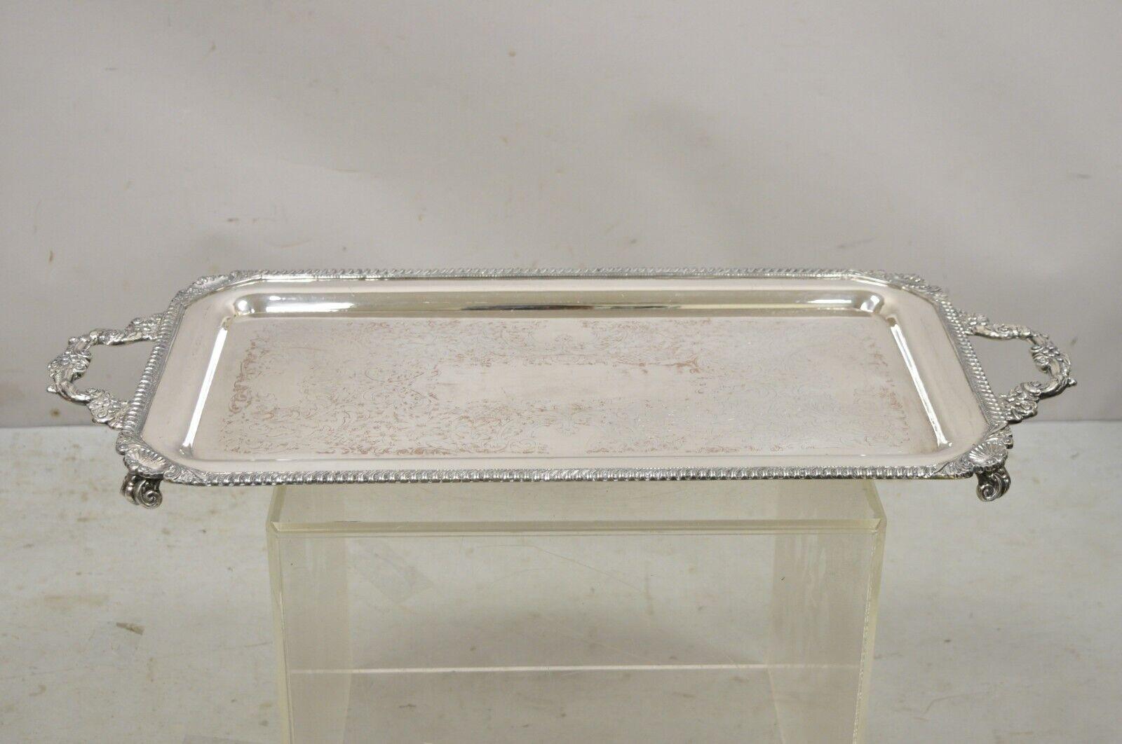Vintage Victorian style silver plated twin handle ornate serving platter tray. Item features a nice narrow form, 