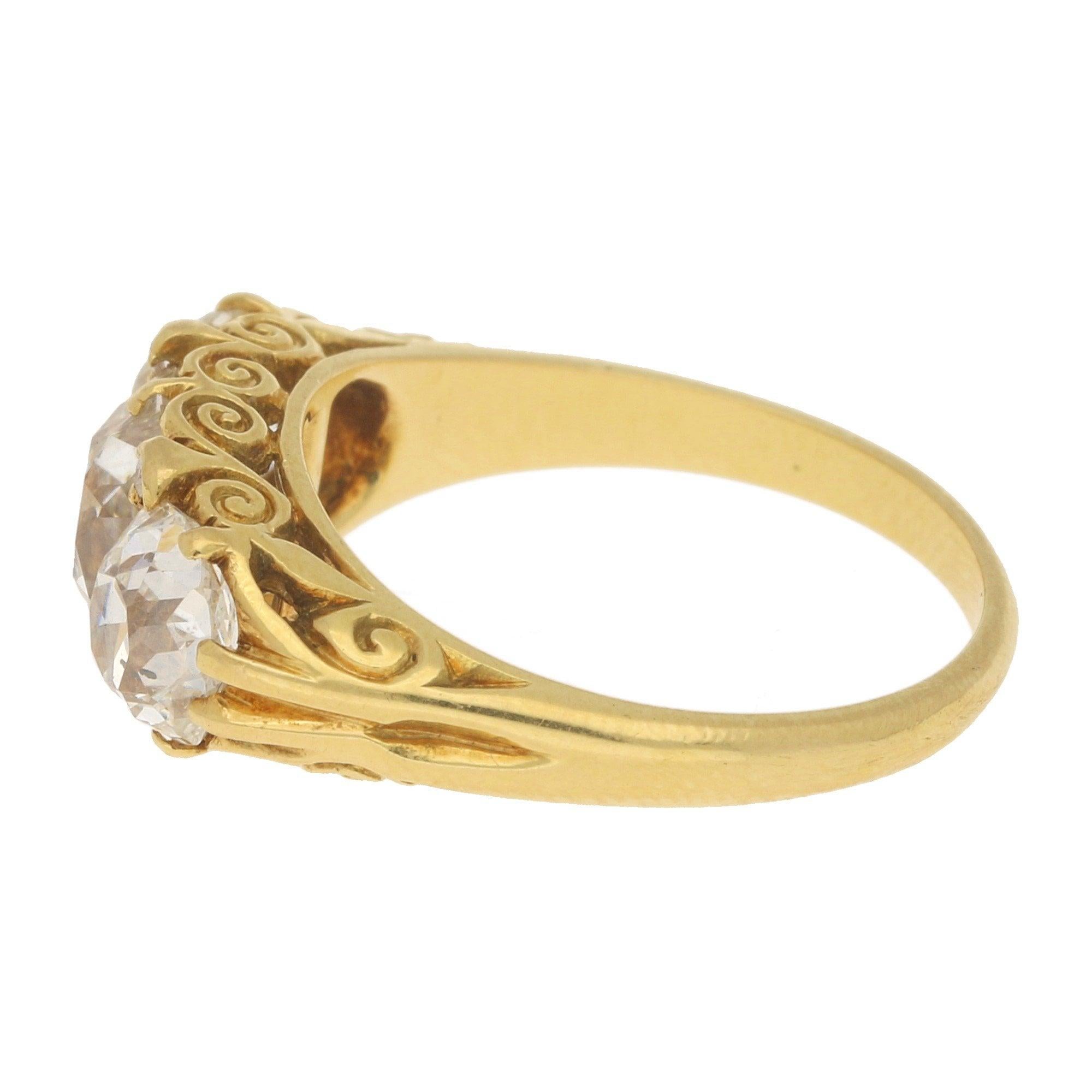 A beautiful late Victorian old mine cut diamond three stone ring set in 18k yellow gold.

The ring is centrally set with a stunning 1.66-carat old mine cut diamond. To either side of this central diamond are two other perfectly matched old mine