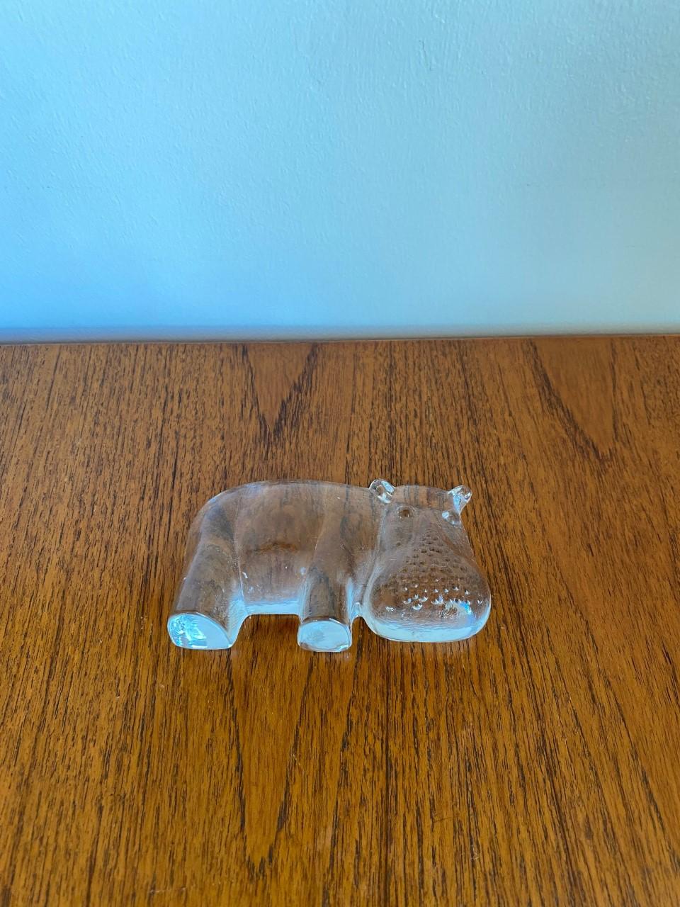 Beautiful clear glass hippopotamus paperweight by the Viking Glass Company. The glass figurine is flat on the back side, this allows the figure to stand on its own, be able to set flat against the wall, or lay flat. Perfect as a paperweight or as a