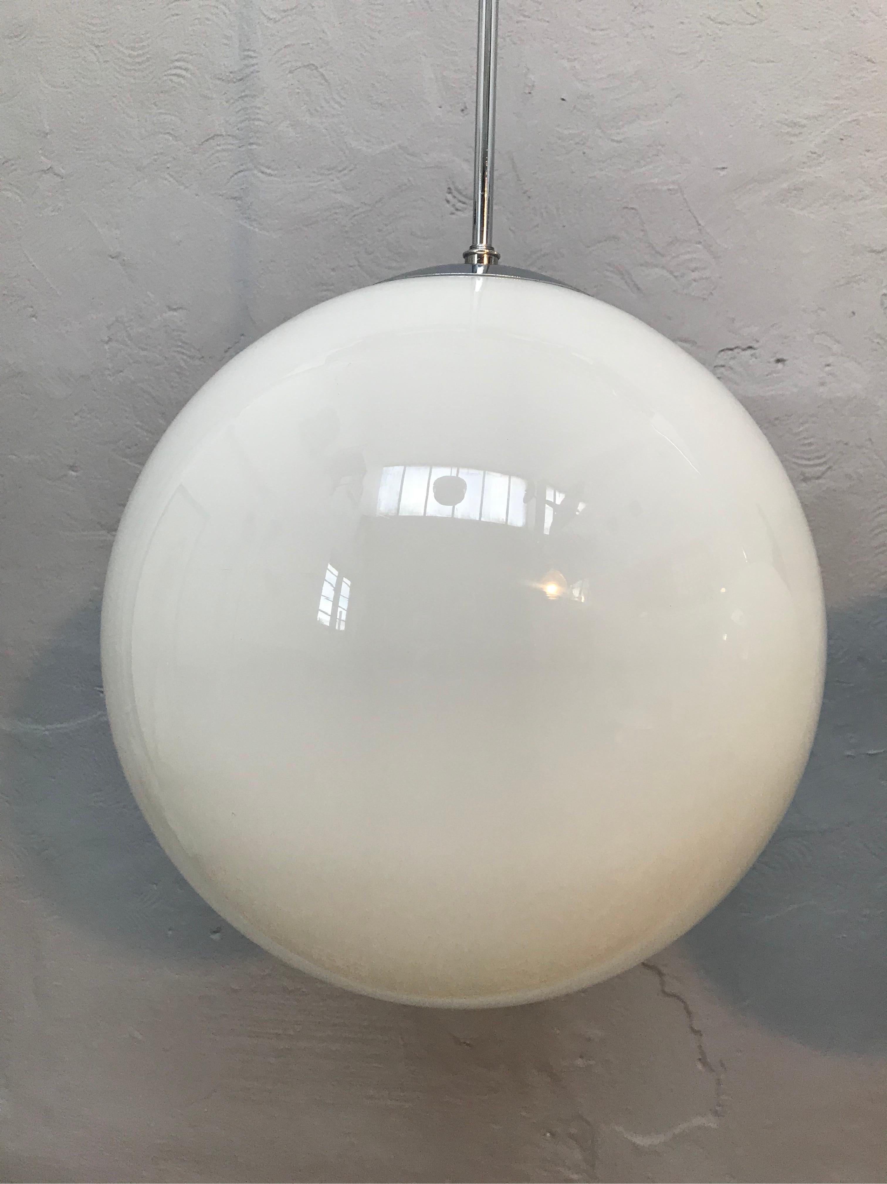 Large vintage Danish Vilhelm Lauritzen for Louis Poulsen opaline hand blown glass pendent chandeliers.
In original condition with new wiring and grounded.
Hanging on a 90cm long nickel plated copper pipe that can be shortened and rethreaded if so