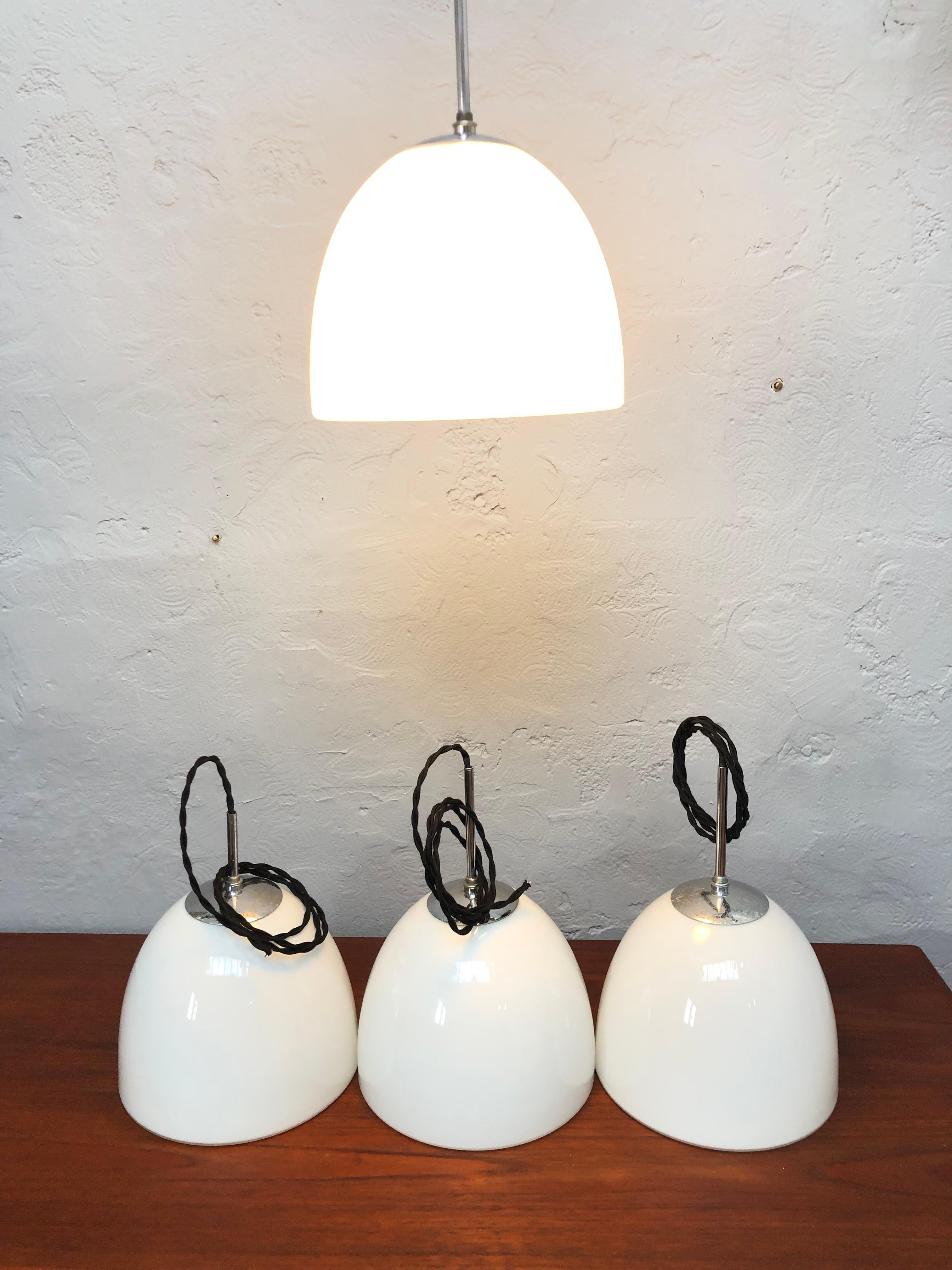 Vintage Danish Vilhelm Lauritzen for Louis Poulsen Delta opaline glass bell shaped pendant chandelier.
With new twisted black cloth wiring. 
Double insulated so no need for grounding. 
1.5 meters of cable. 
Great mid-century Danish