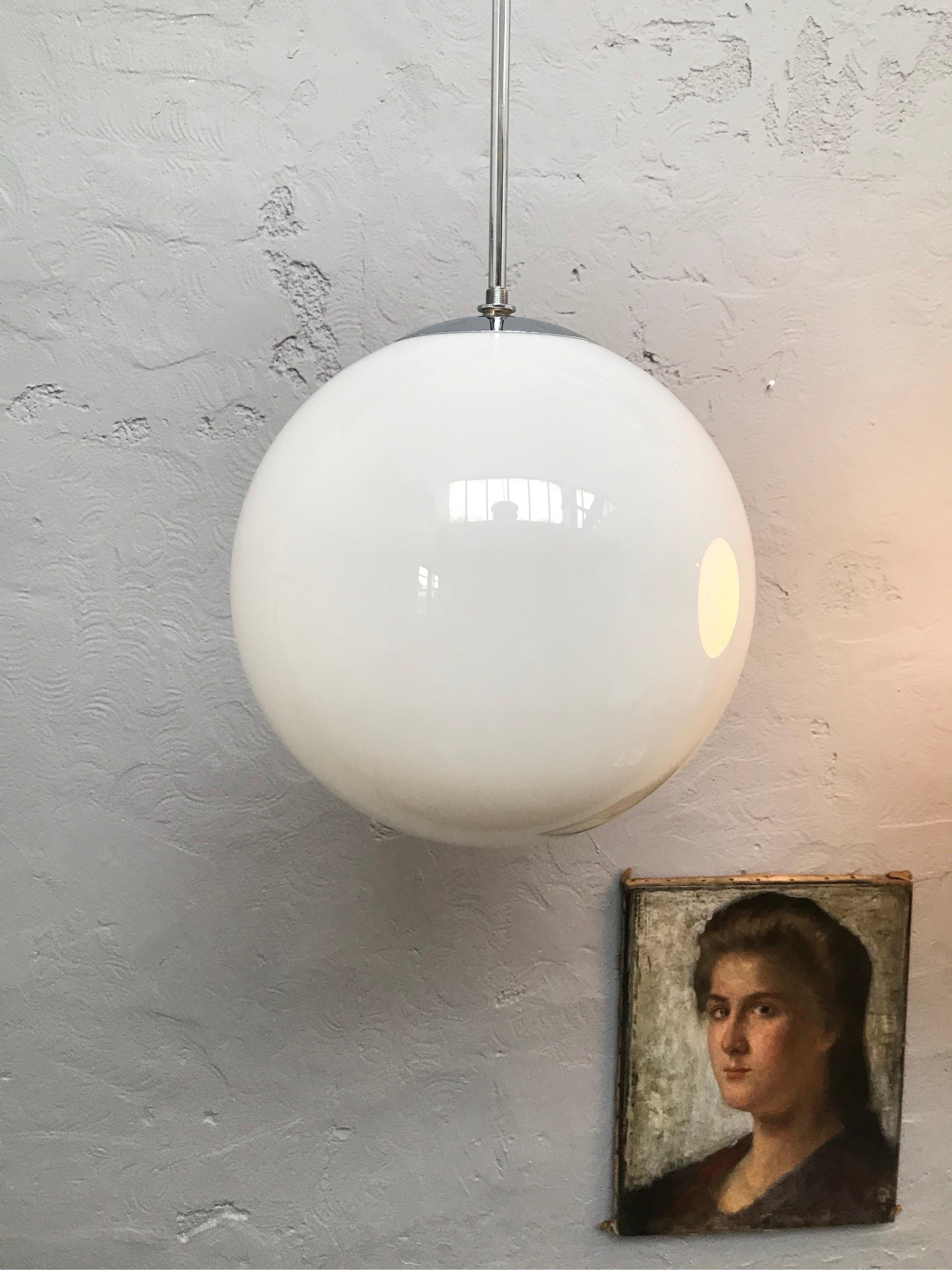 Vintage Danish Vilhelm Lauritzen for Louis Poulsen opaline hand blown glass pendant chandeliers.
In original condition with new wiring and grounded.
Hanging on a 30cm long nickel-plated copper pipe.
Great midcentury Danish design.     
  