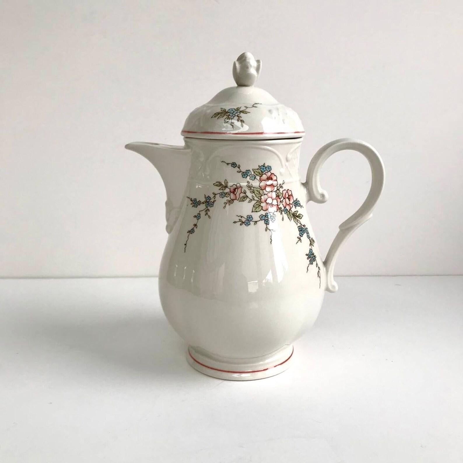 Villeroy and Boch rosette porcelain teapot.

Manufactured in Germany.

This Beautiful Romantic Teapot with Pink and Blue Flowers will Create a Special Atmosphere Coloring Long Evenings in the Family