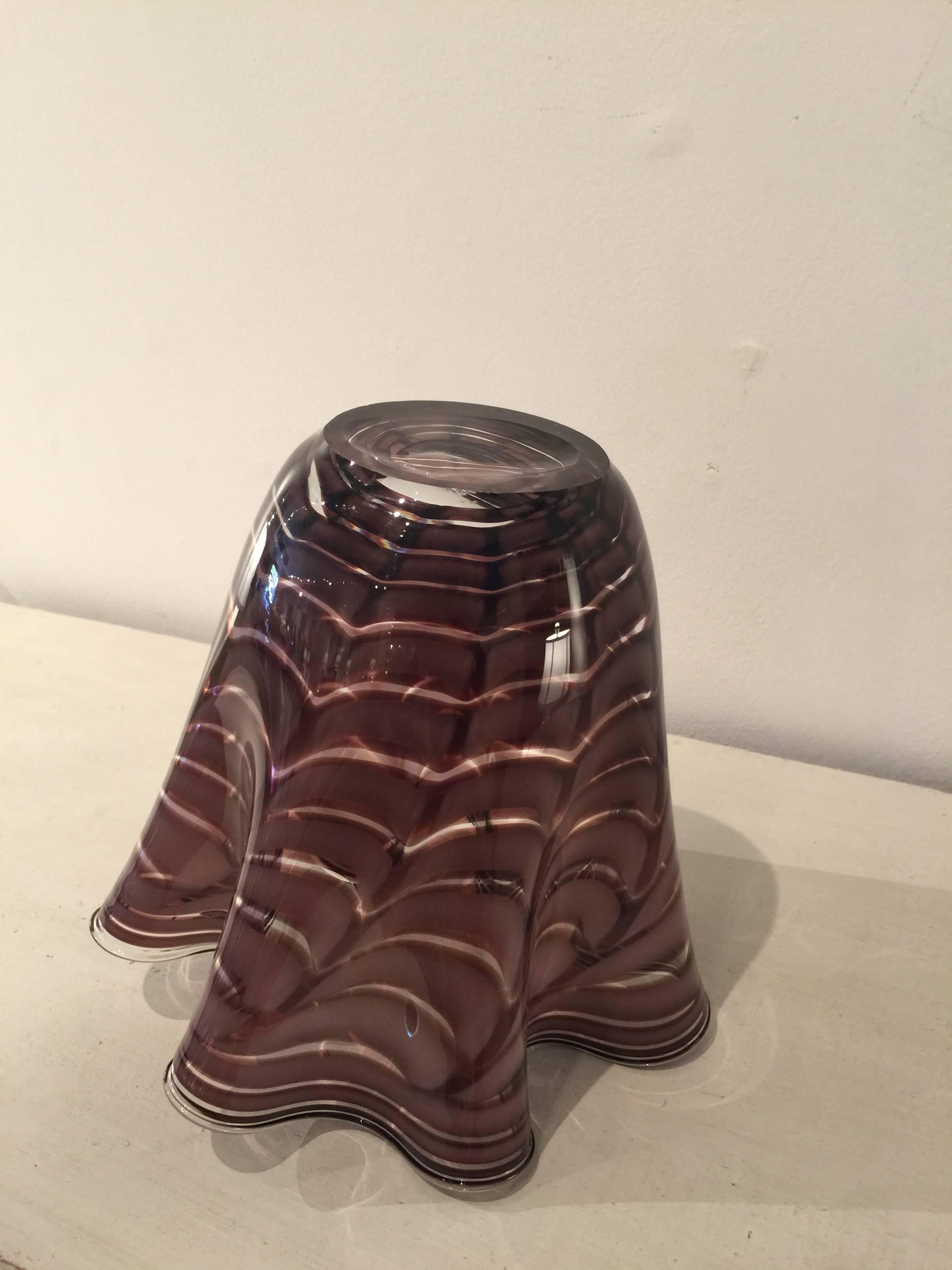 Vintage Murano glass vase with beautiful wave pattern.
Subtle colors of aubergine and violet throughout.
Measure: Diameter 12.5'' height 10