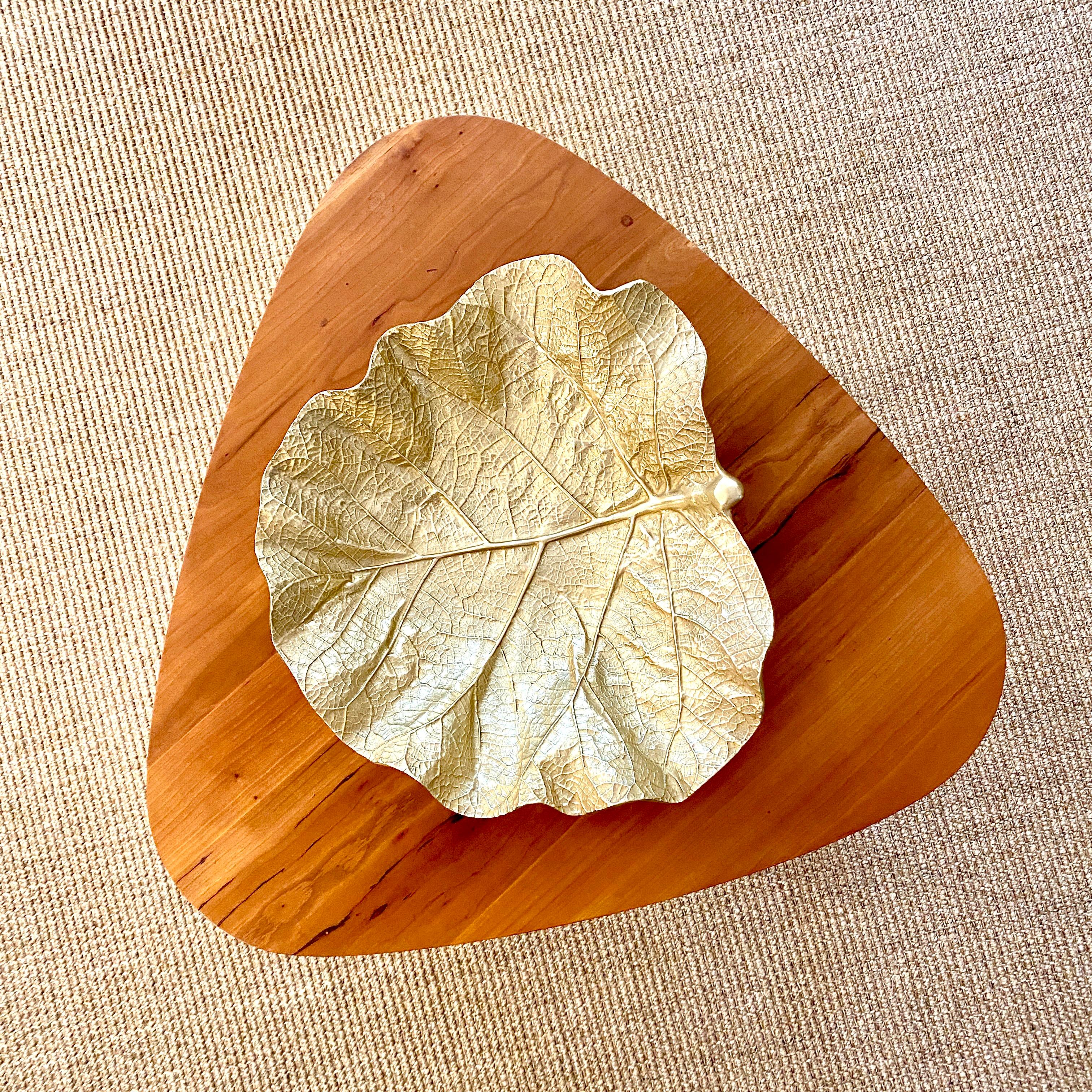 Vintage gold anodized aluminum alloy bowl in the shape of a Sea Grape leaf. The leaf designs were designed by well known sculptor Oskar Hansen for Virginia MetalCrafters in Waynesboro, Virginia. The leaf is hand made, hand finished and of the
