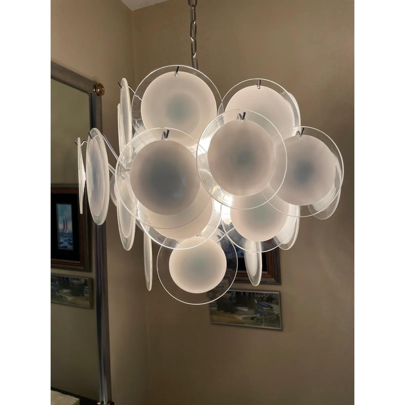 Gino Vistosi and Murano chandelier/swag made in Italy. 32 milk and clear handblown Murano glass discs chrome fixture and chain.
Curbside to NYC/Philly $350