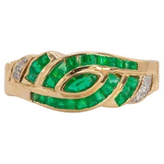 Anillo vintage de esmeralda y diamantes en oro amarillo de 18 quilates
