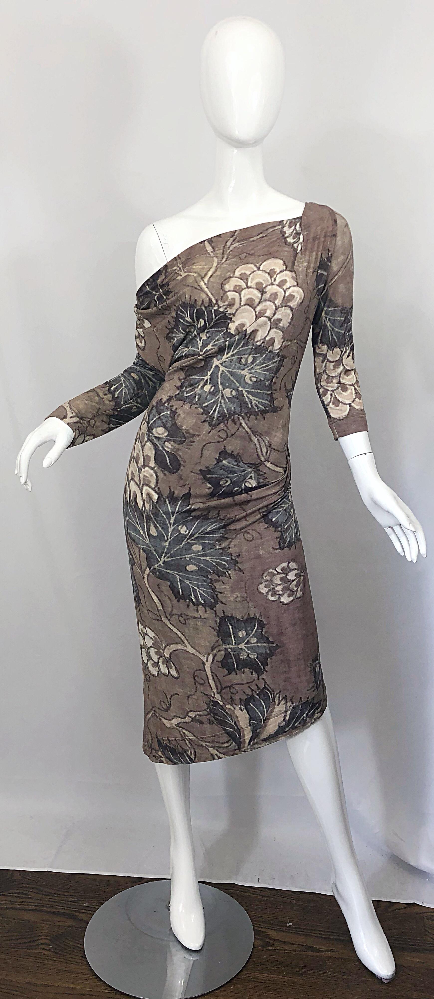 Sexy 1990s VIVIENNE WESTWOOD light brown, ivory and blue leaf print off-the-shoulder asymmetrical rayon jersey dress! Sits off the right shoulder. Warm tones that compliment pretty much any skin tone. Simply slips over the head, and stretches to