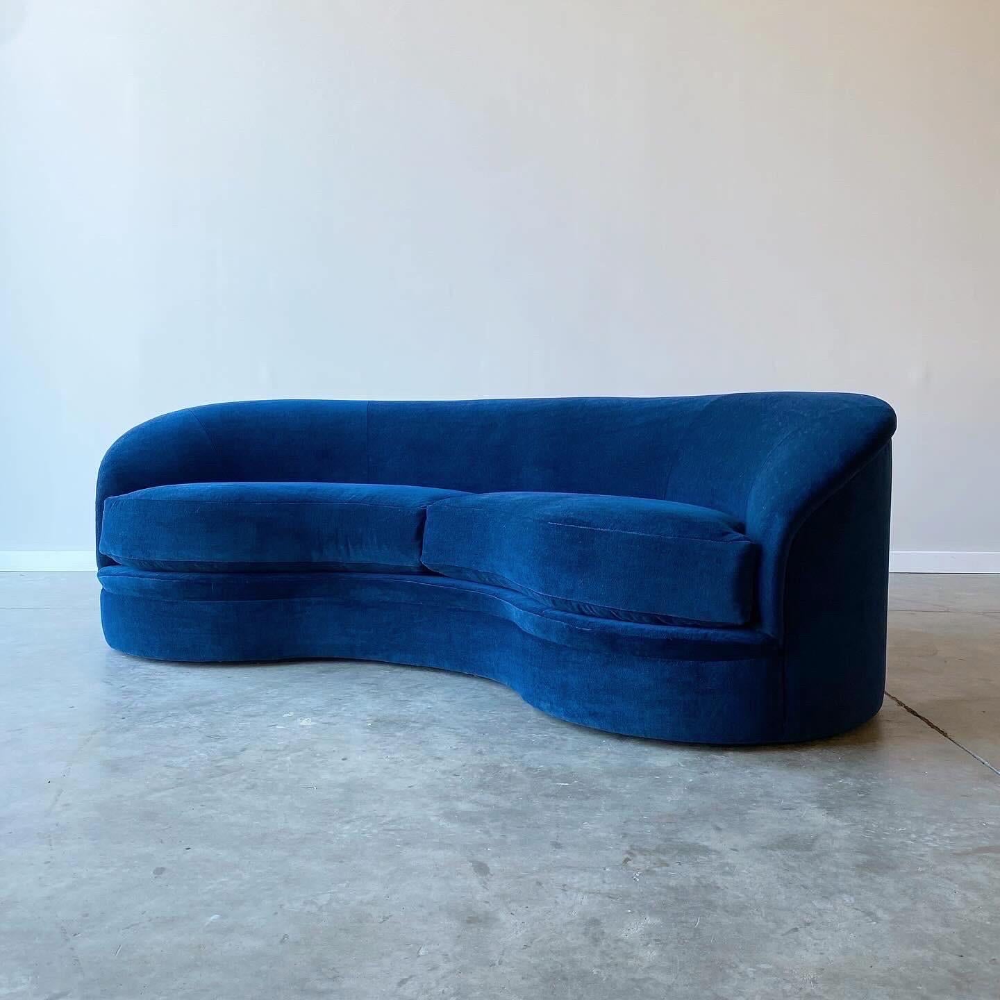 Classic curved form to this luxurious sofa.  Made by Directional in the 1980s and newly upholstered in midnight blue mohair.  Very comfortable sit with heavy cushions and deep seat.  

Note the upholstery shows a touch darker in person than in the