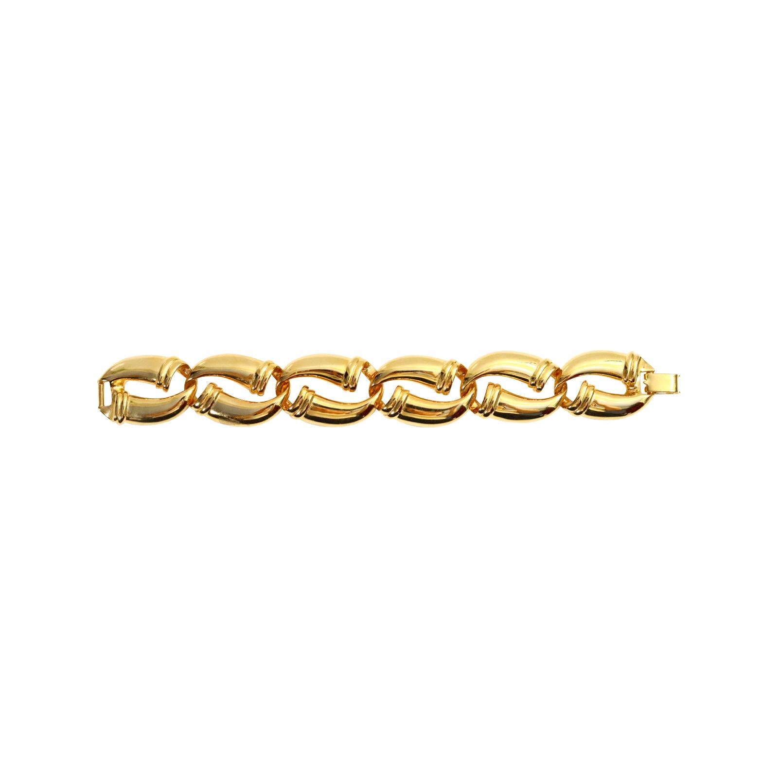 Vintage VO Gold Tone Oval Links Bracelet Circa 1980s. The links each have a design at the end of each side, on top and bottom, where they link into each other.  Almost looks like a horn. This is a sturdy and well-made bracelet.  It would look great