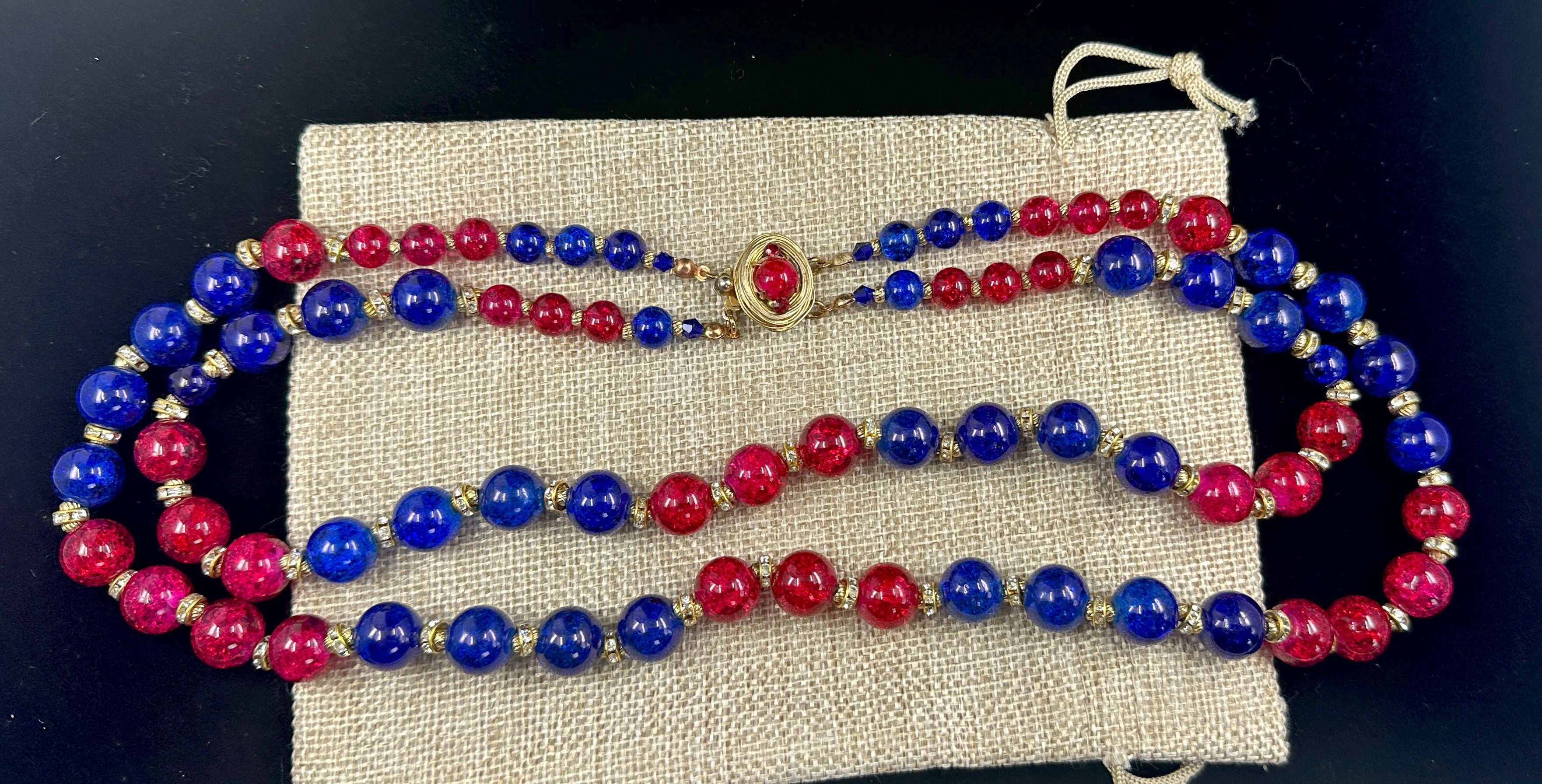 This is a sumptuous Vintage VOGUE Gripoix Red and Blue Crackle Glass Bead Necklace with Crystal set rondelles. The multi Strand Runway Necklace has two rows of crackle glass beads in gorgeous blue and red. There are wonderful crystal set rondelle