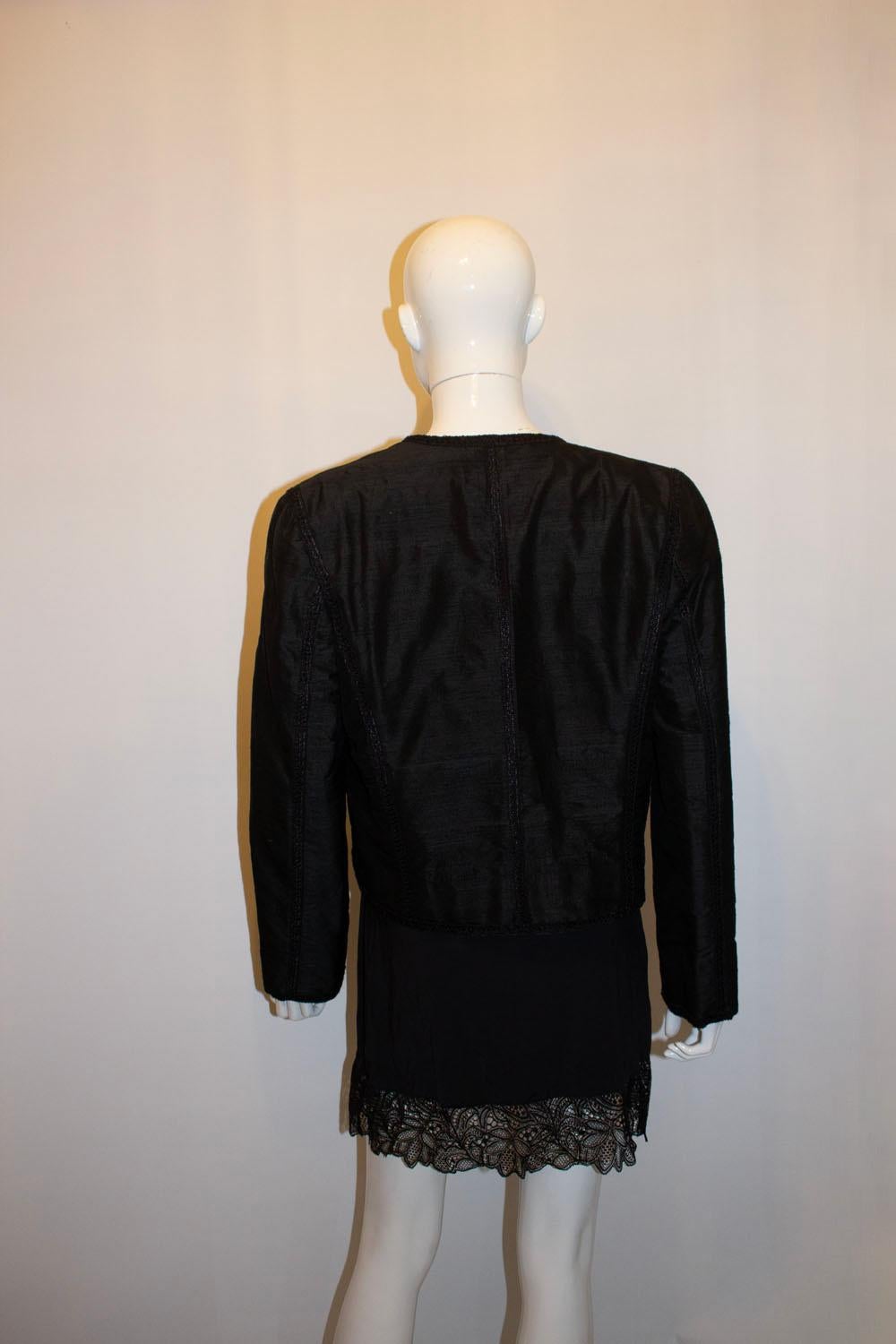 A stunning vintage black silk evening jacket. The jacket is in a wonderful raw silk with decorative trim. It doesnt have a fastening , but one could be easily added and is fully lined.
Measurements: Bust  up to 38'', length 21''