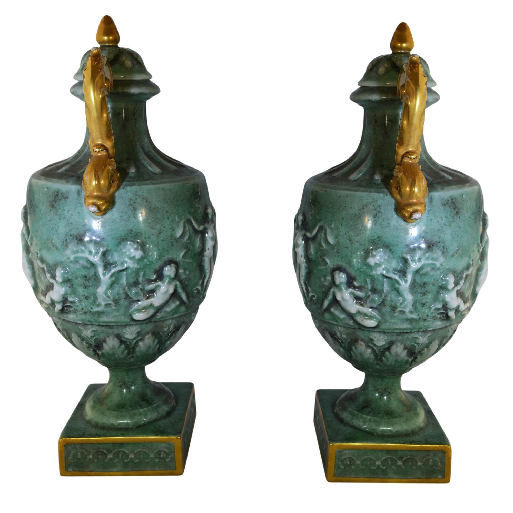 Vintage Von Schierholz urns have putti dancing around the body and feature a 3