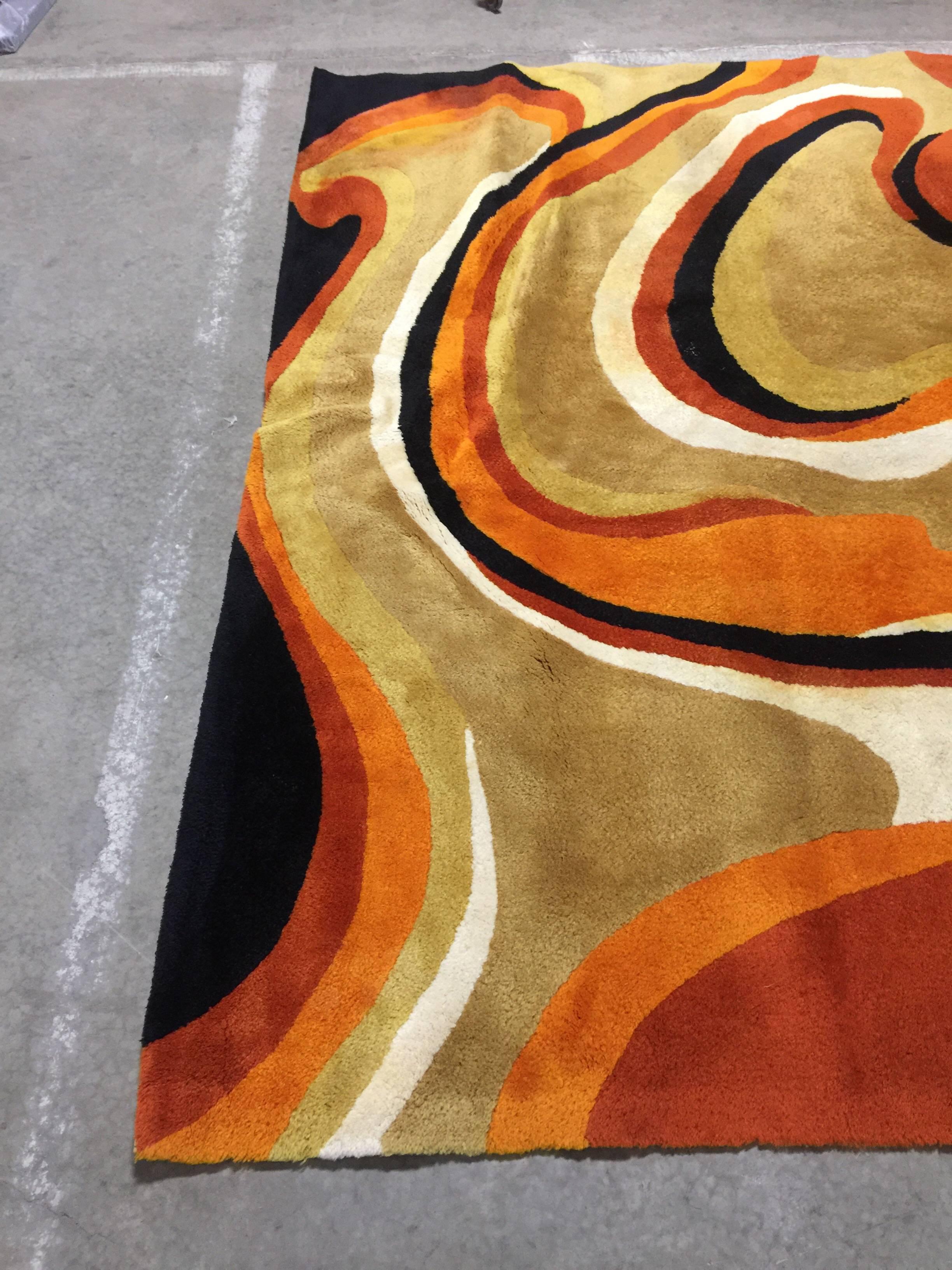 A large vintage custom area rug by V'Soske. Signed with label to underside. Made of all virgin wool, circa 1960-1970.

Features a midcentury influenced multi-color abstract pattern.

Dimensions 105 inches x 143 inches (approx. 9 feet x 12