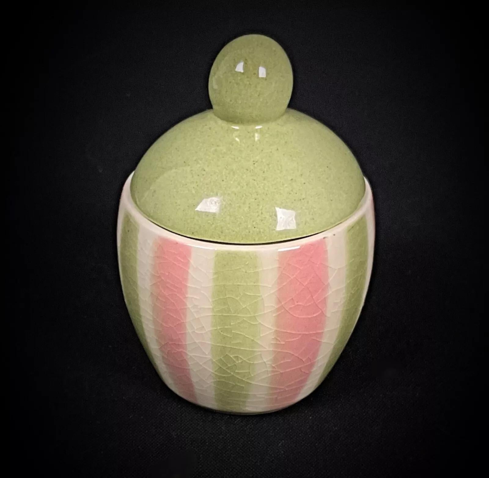 This charming vintage mustard pot by W. Goebel showcases a beautiful crackled glaze finish, characteristic of mid-century West German craftsmanship. With its compact size and distinctive glaze, this piece adds a touch of rustic charm and collectible