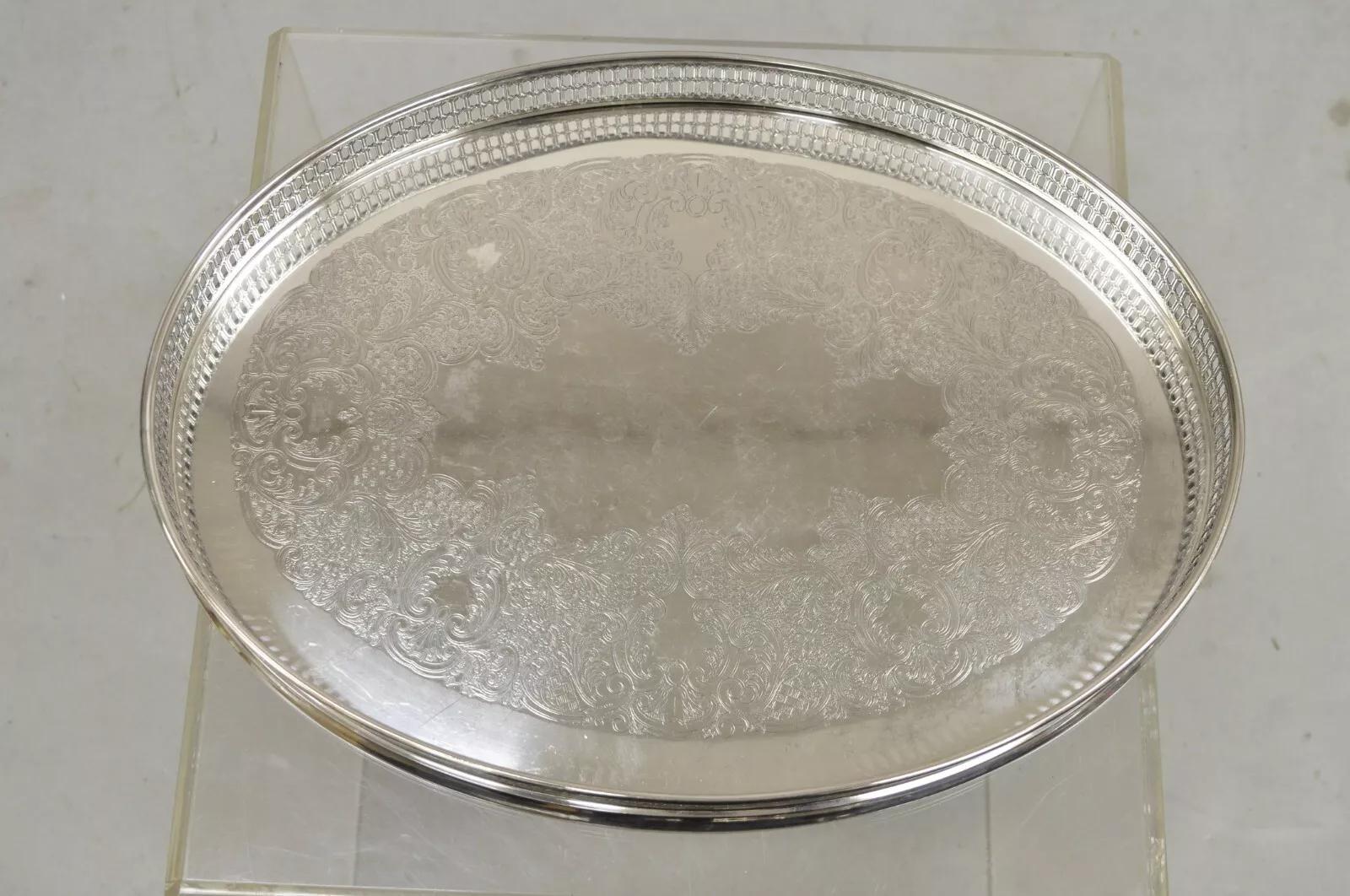 Vintage WA Italy Oval Silver Plated Pierced Gallery Serving Platter Tray. Item features scrollwork etched center, original hallmark, quality Italian craftsmanship. Circa Mid 20th Century. Measurements: 2