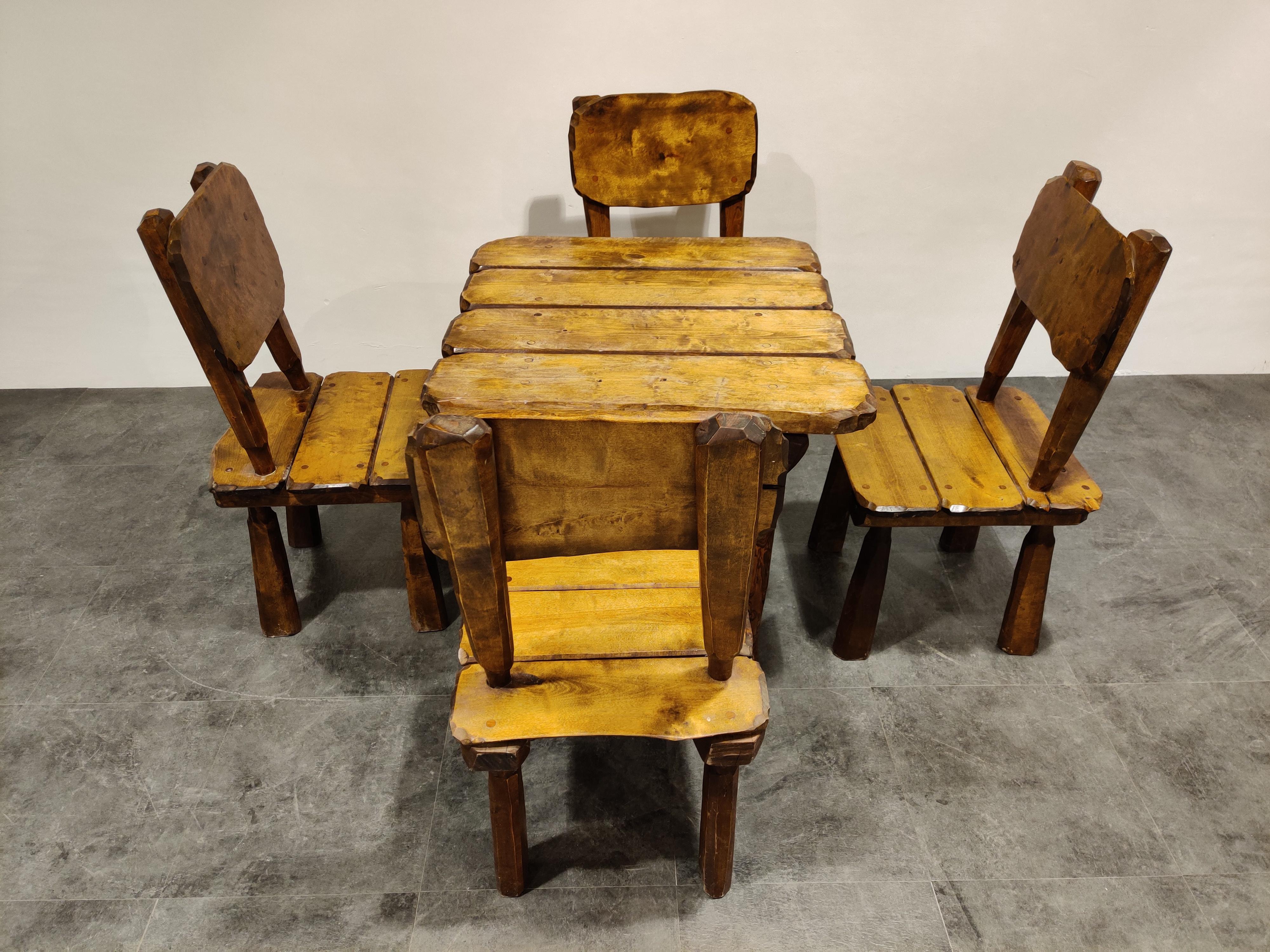 Midcentury 'wabi sabi' dining table and chairs made from solid wood with a beautiful pattern.

This is entirely handmade and the rough design looks fantastic.

Suitable for both in and outdoor use.

Good condition.

1960s,