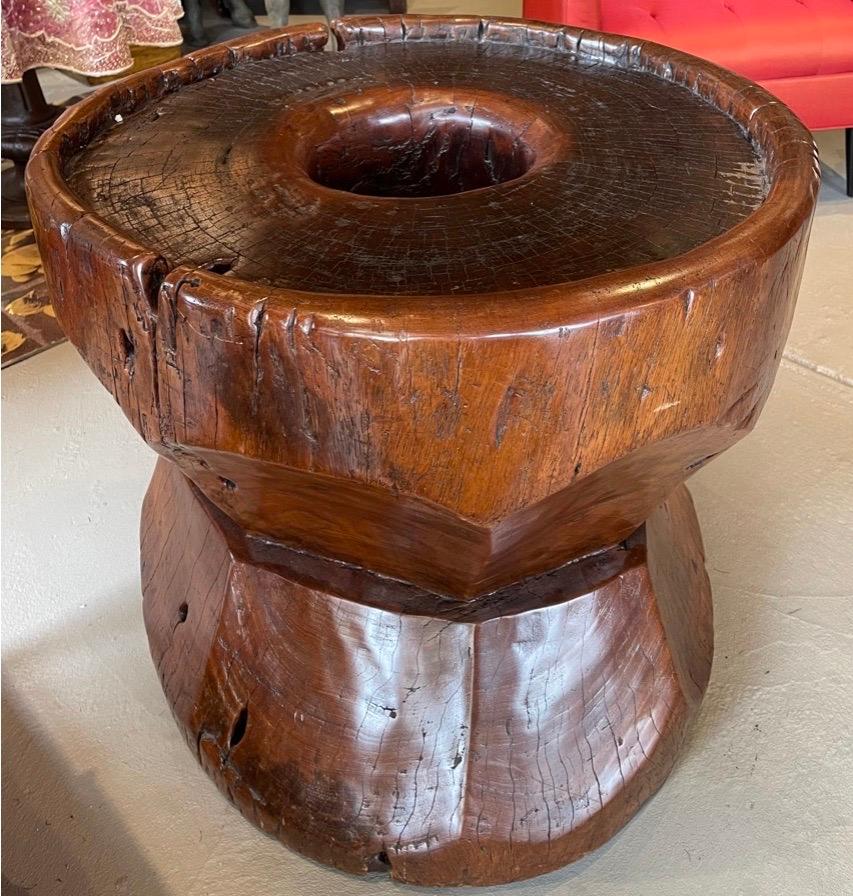 If it is possible to have a crush on a piece of furniture then I am guilty. This massive solid teak table is gorgeously carved. The patina is burnished and aged in the most spectacular way. I can't be certain of the center was used for grinding. I