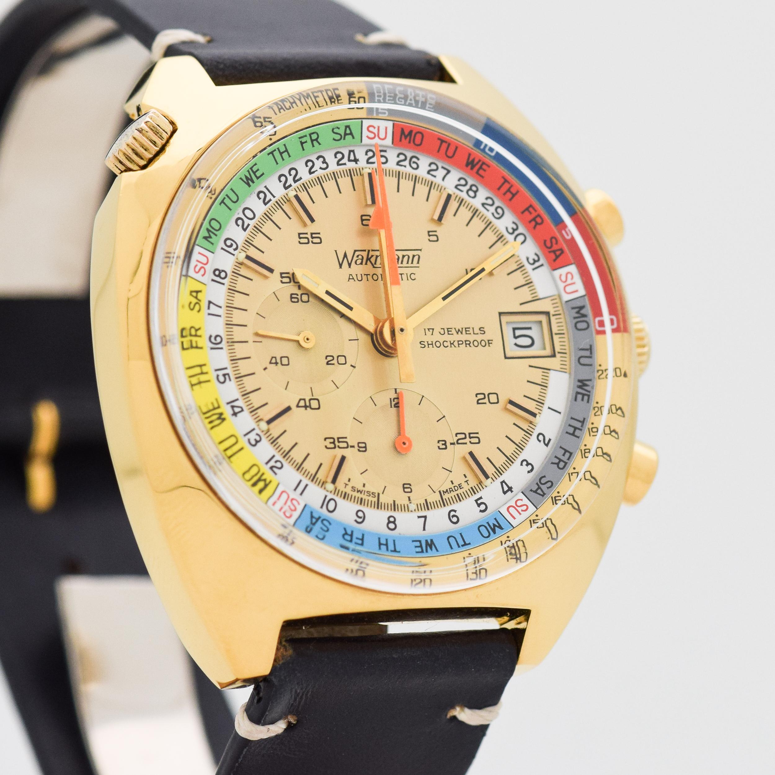 1970's Vintage Wakmann Automatic Day - Date 2 Register Chronograph Base Metal watch with RARE Original Multi-color (Red, Dark Blue, Light Blue, Yellow, Green, Gray, and White) Dial with Applied Beveled Gold Color Bar Markers. 42mm x 47mm lug to lug