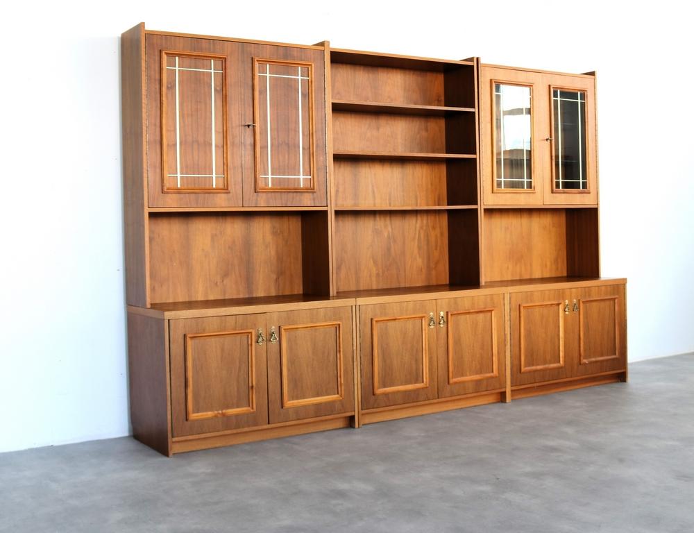vintage wall cabinets  wall unit  60s  Sweden

period  60's
design  unknown  Sweden
condition  good  light signs of use  1 cupboard with restoration
size  176.5 x 90 x 45 (hxwxd) = one cabinet. 
details  teak; glass; 3 different wall cabinets can be