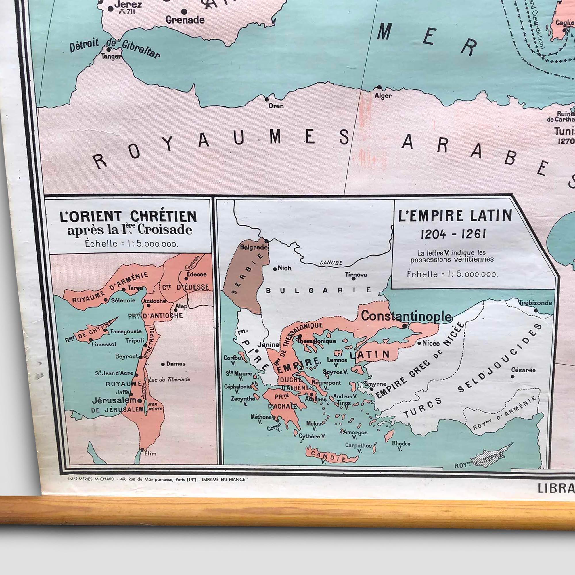 A beautiful, original vintage map of the crusades ('Les Croisades') in the early Middle Ages in Europe, North Africa, and the Middle East. This pull-down map was used in European schools for teaching purposes. It has a splendid color design and
