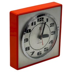 Horloge murale vintage par Stärke - Design des années 70 avec des nuances d'orange et de chrome