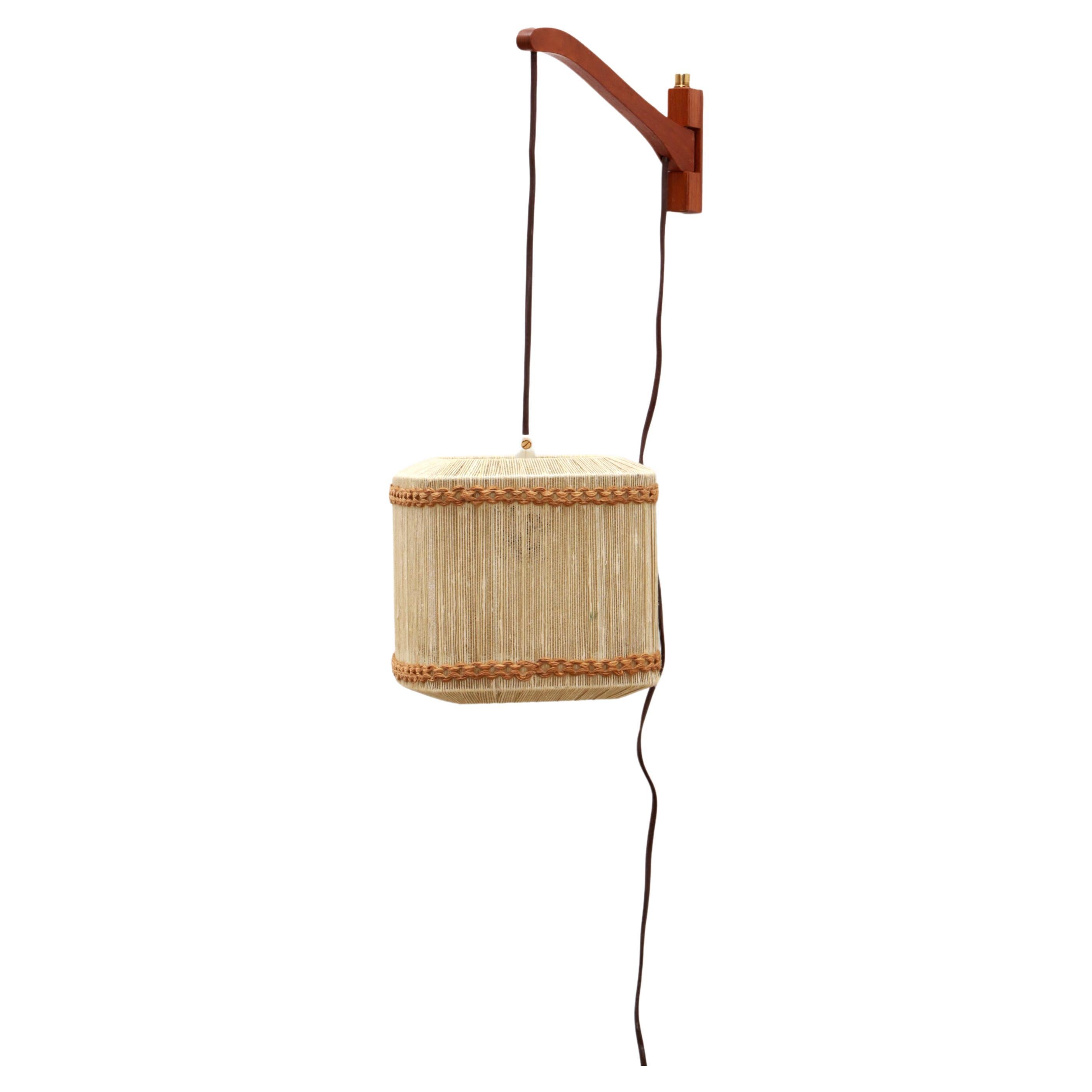 Vintage Wall hanging lamp made of rope and teak, 1960s Sweden.