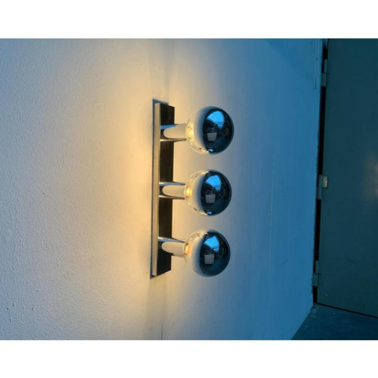 Imposing mid century ceiling or wall light from staff after a design of the japanese designer motoko ishii.

this design convinces with its reflective surfaces. The game with reflections creates a special depth. The reflecting surfaces double the
