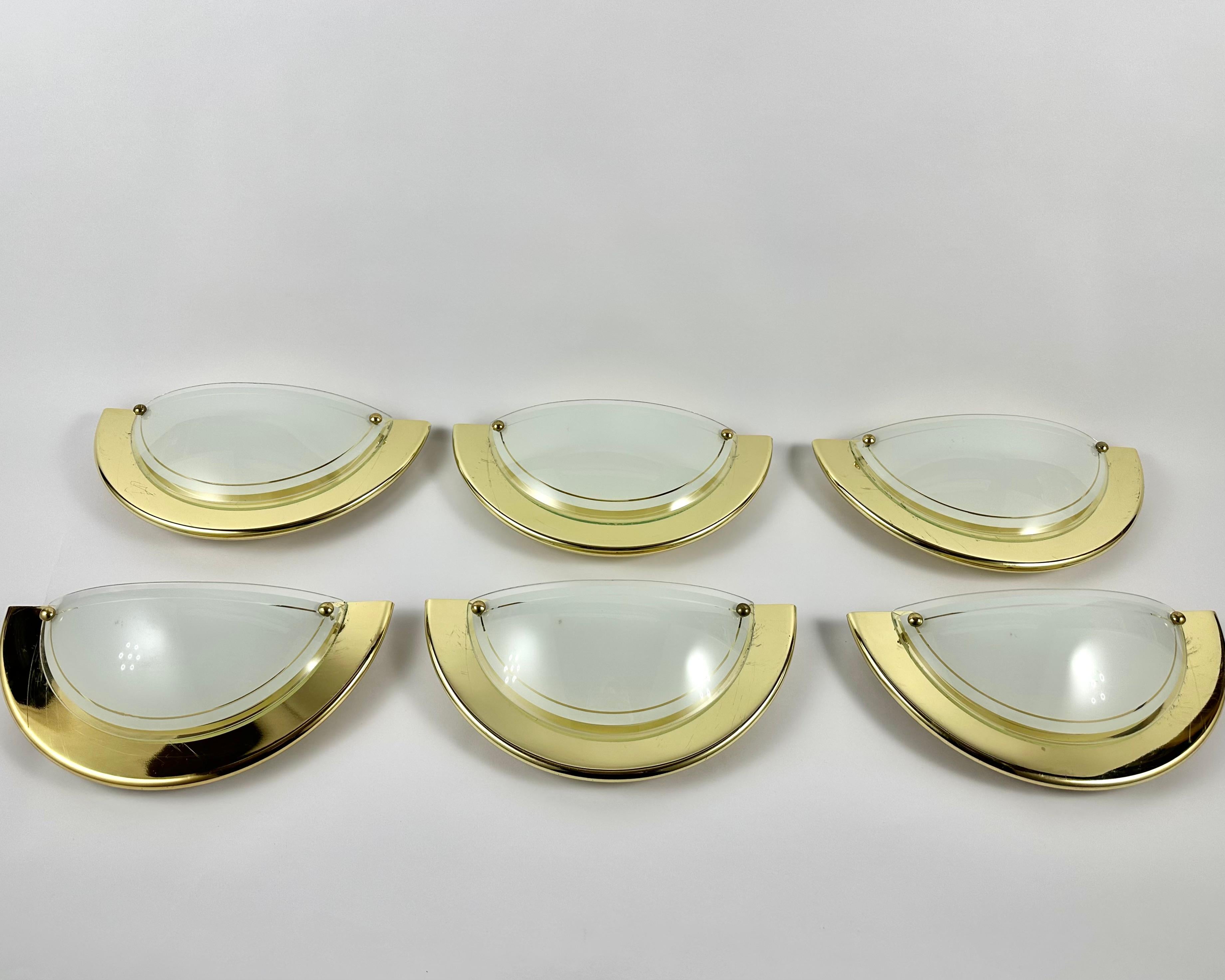 Vintage wall lamps from Massive Lighting, Belgium, circa 1970s.

  The Sconces are made of high quality glass with gilt metal elements.  

Stylish wall lamps will fit into any interior of the house and will be an excellent room decor in any