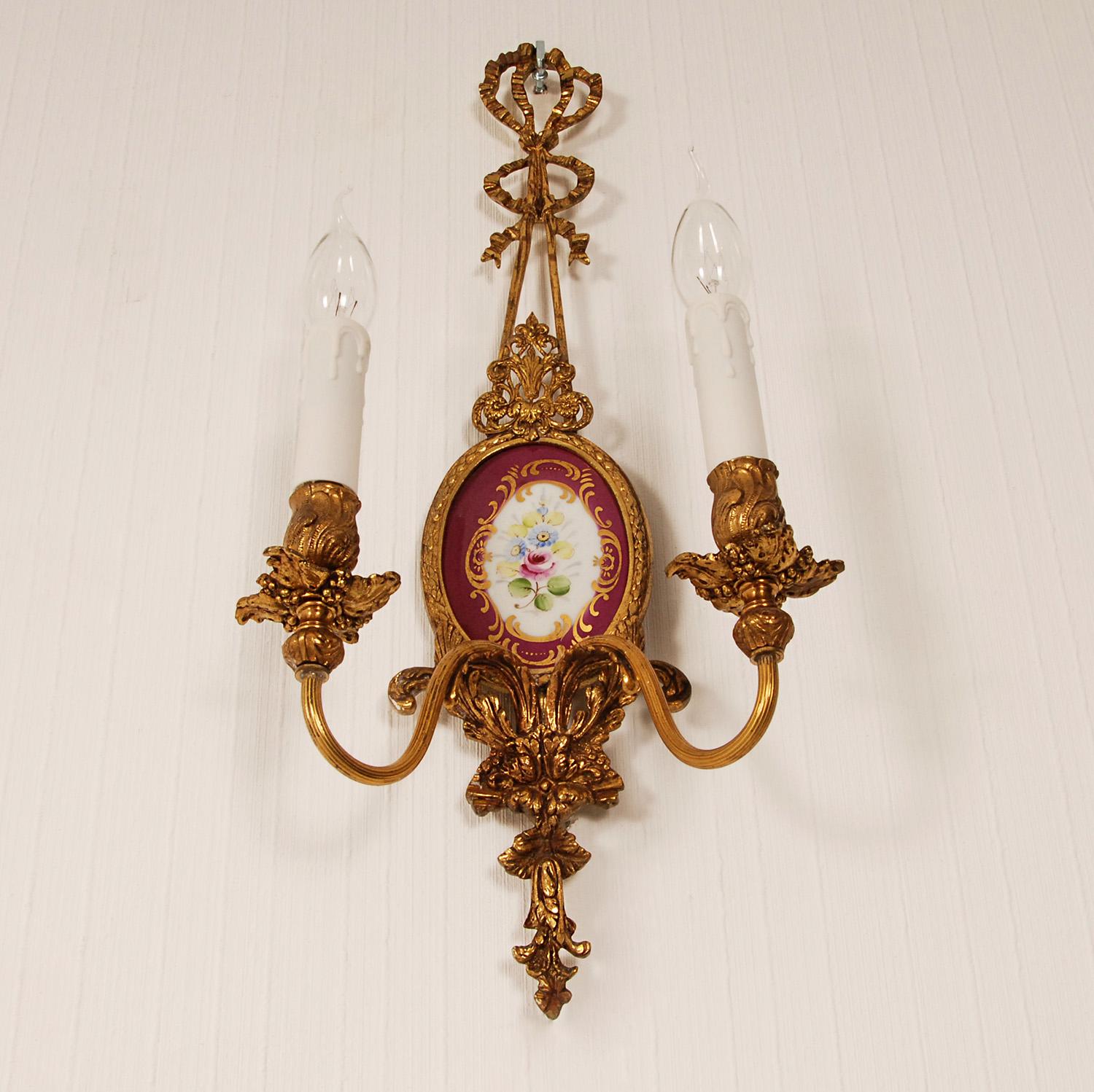 A pair vintage Italian Wall Lamps cast gold Gilt Bronze with Ribbons and Porcelain.
Style: Italian, Vintage, NeoClassical, Louis XVI, Traditional, Antique, Baroque
Design: In the manner of Caldwell, Stiffel, Frederick cooper
Wall sconsces made of