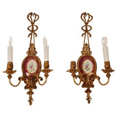 Lampade da parete d'epoca oro dorato bronzo nastri porcellana coppia di appliques neoclassiche