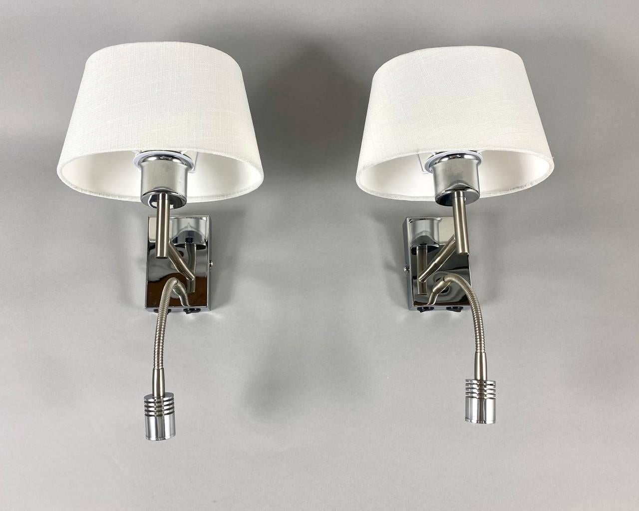 Vintage Wall Lamps with New white fabric shades and LED reading light by Honsel Leuchten. 

2000s.

The lamps are a combination of stainless steel with a carefully selected textile shade, which creates a very elegant lamp. They are perfect not