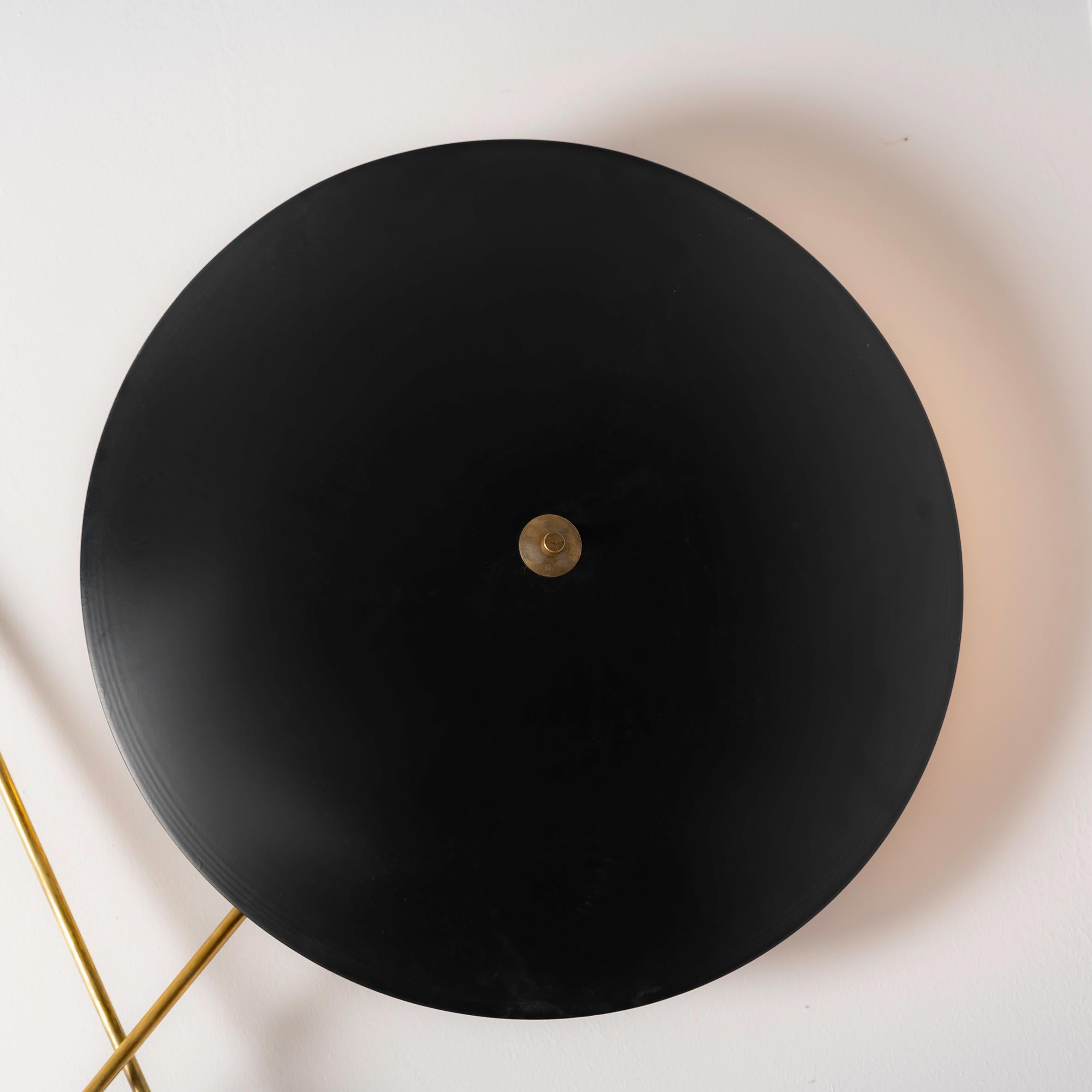 Purchasing this Vintage Wall Light consisting of two reflectors extending through the wall by Bruno Gatta for Stilnovo from the 1950s offers a unique opportunity to own a piece of design history that seamlessly blends functionality with aesthetic