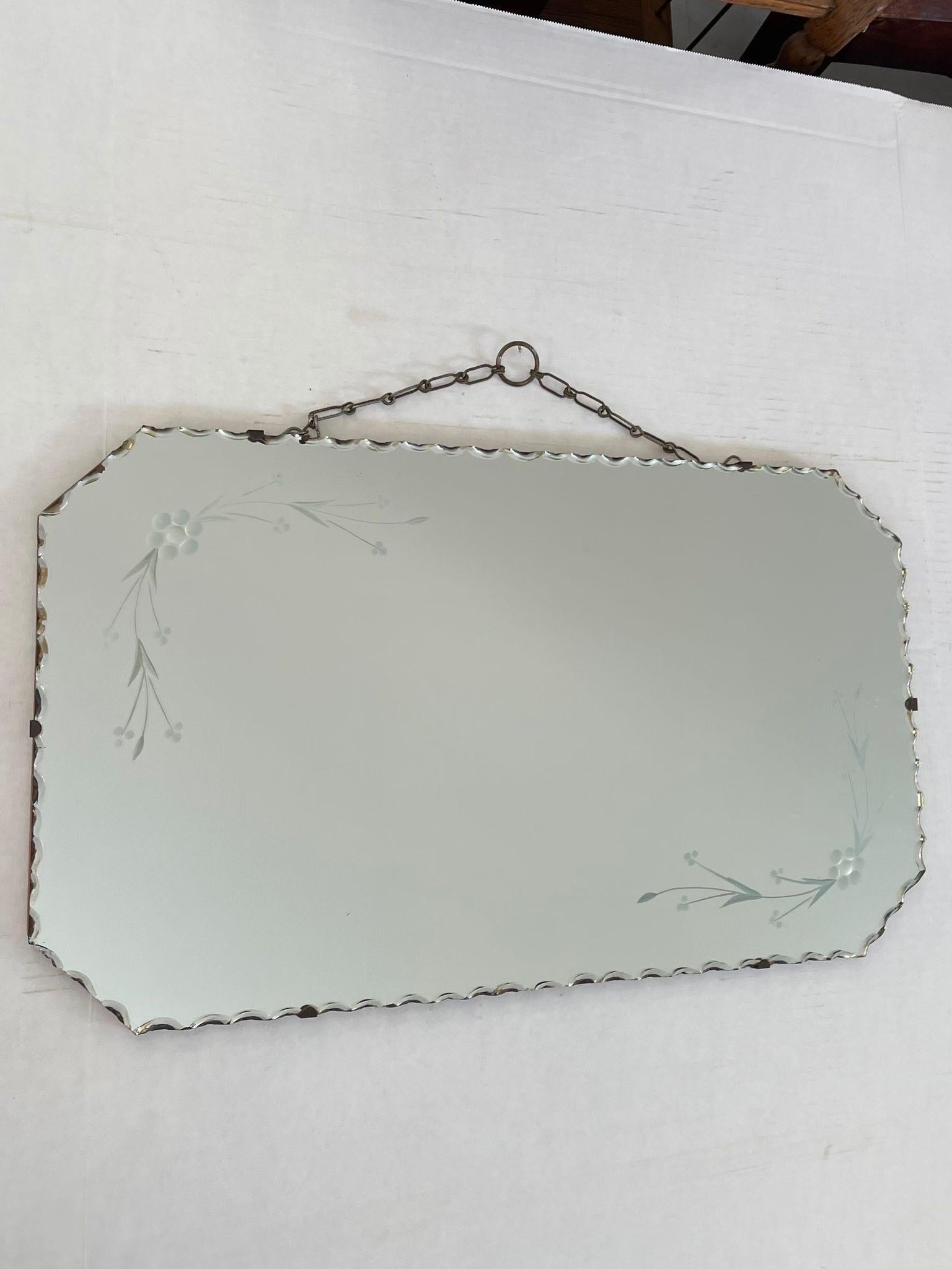 Vintage Mirror With Chain To Hang From. Circa 1930s to 1940s Petina Around the Edges. Vintage Condition Consistent with Age as Pictured.

Dimensions. 24 W ; 14 H
